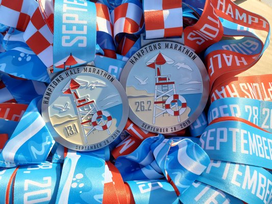 The Hamptons Marathon and Half Marathon medals.