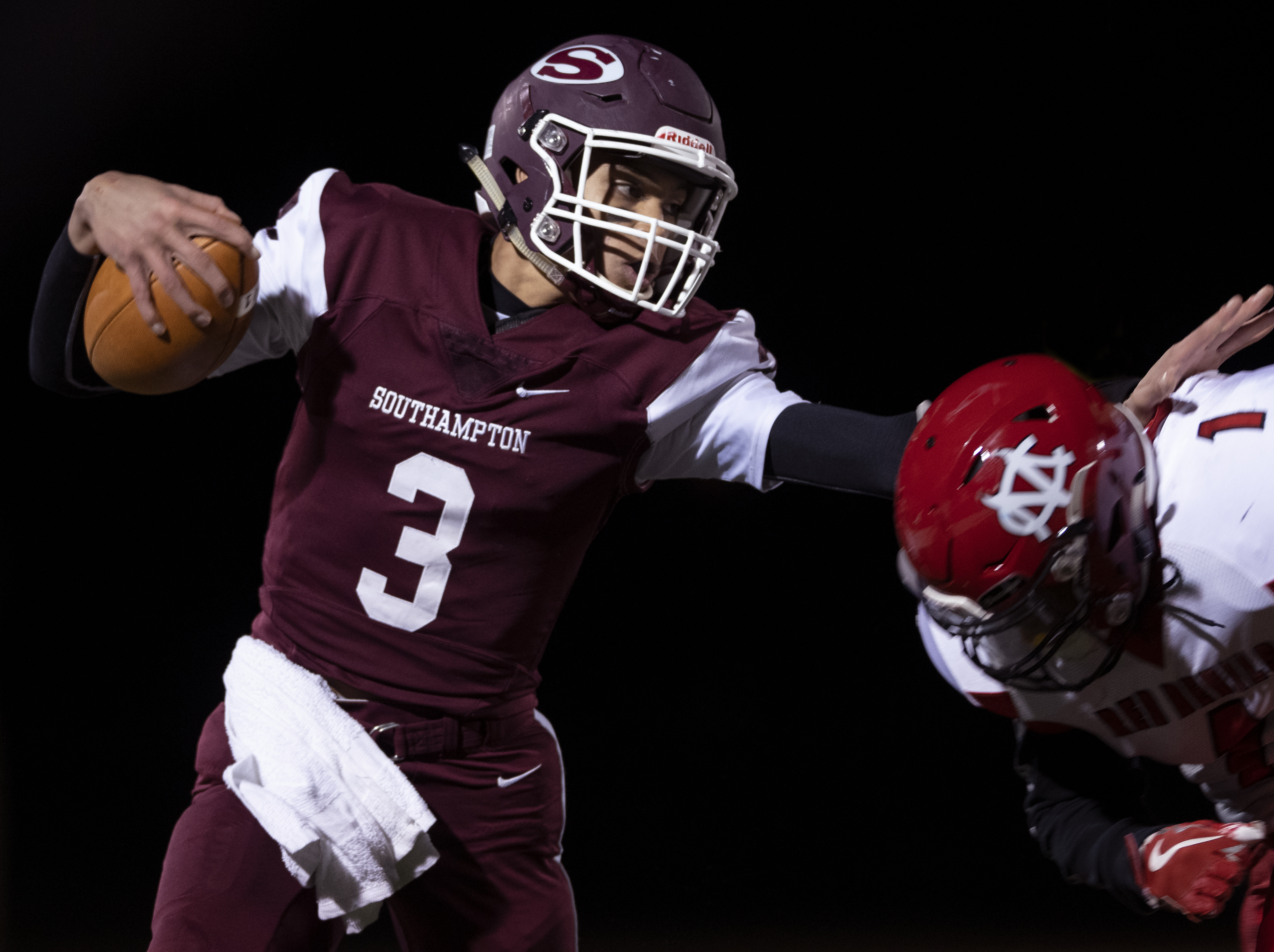 Southampton senior Dakoda Smith avoids being tackled by a Center Moriches defender.