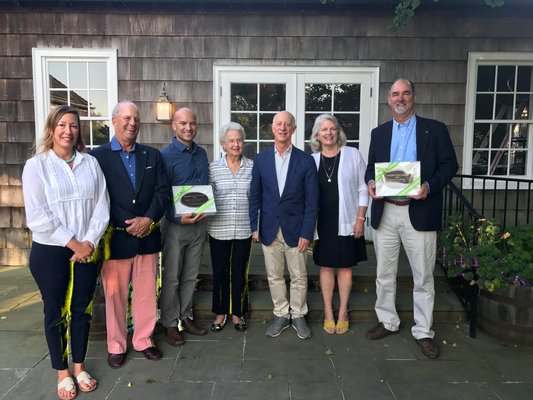East Hampton Village Trustees Rose Brown and Tiger Graham, Amagansett Life-Saving Station President and Town Councilman David Lys, Village Preservation Society President Joan Osborne, guest speaker Paul Goldberger, Town Councilwoman Sylvia Overby and Town Supervisor Peter Van Scoyoc.