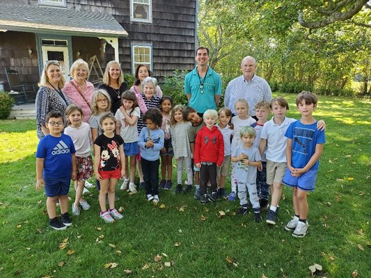 Sagaponack School students walked Barbara Albright's house to surprise her with a birthday song and card on Wednesday. Ms. Albright is a longtime supporter of the school.