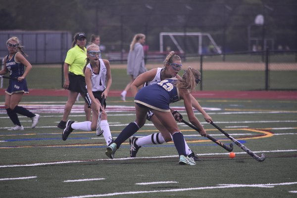 Southampton senior Emma Wesnofske disrupts a Bayport/Blue Point player trying to send a shot in.