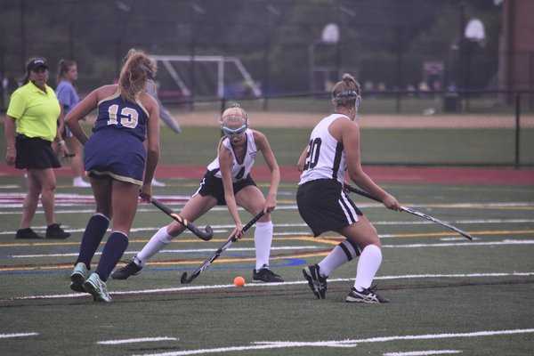 Southampton sophomore Lauren Halsey takes the ball from a Bayport/Blue Point player after teammate Emma Wesnofske created the turnover.