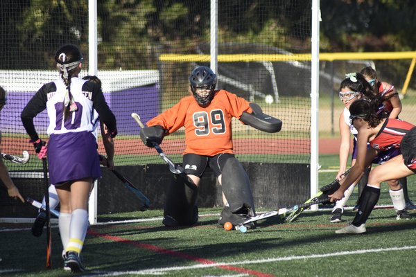 Hampton Bays sophomore goalie Abby Hoffman makes a kick save.