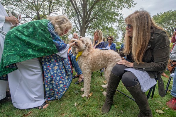 The Reverend Karen Campbell blesses Jill Rappaport's Stanley at the Blessing of the Animals ceremony that took place on the great lawn of the Christ Episcopal Church in Sag Harbor on Sunday morning. MICHAEL HELLER