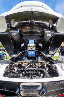 An admirer photographs a $2.8 million, hand-made Koenigseqq Jesco, capable of 300+ mph and one of only 100 Koenigseggs in the entire world, during the Bridgehampton Cars & Coffee event hosted by The Bridge on the grounds of the Bridgehampton Museum on Sunday morning.   MICHAEL HELLER