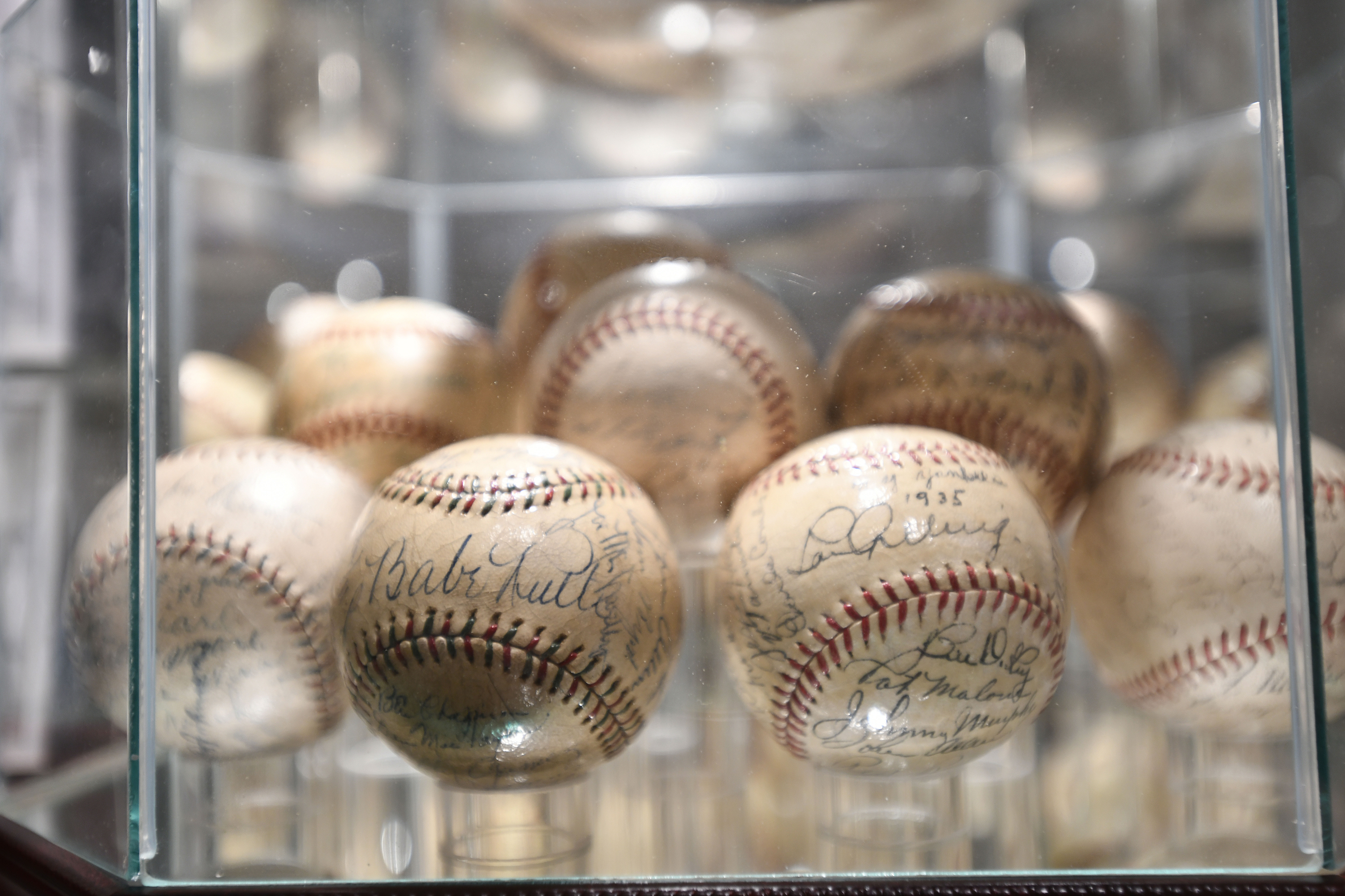 Some of the signed baseballs in Rick Friedman's extensive collection.   DANA SHAW
