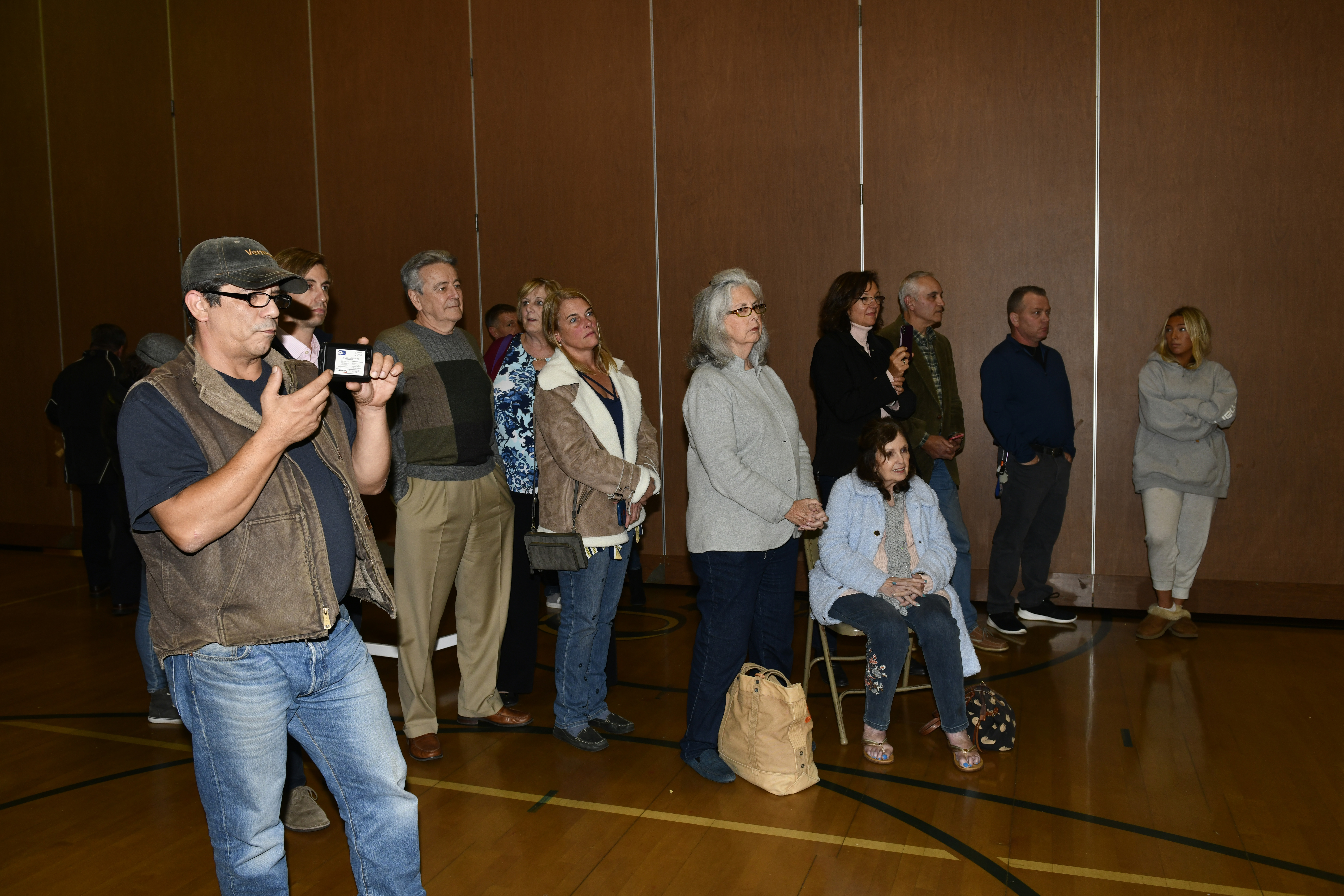 The crowd at the East Quogue School listens to the results of the vote.  DANA SHAW