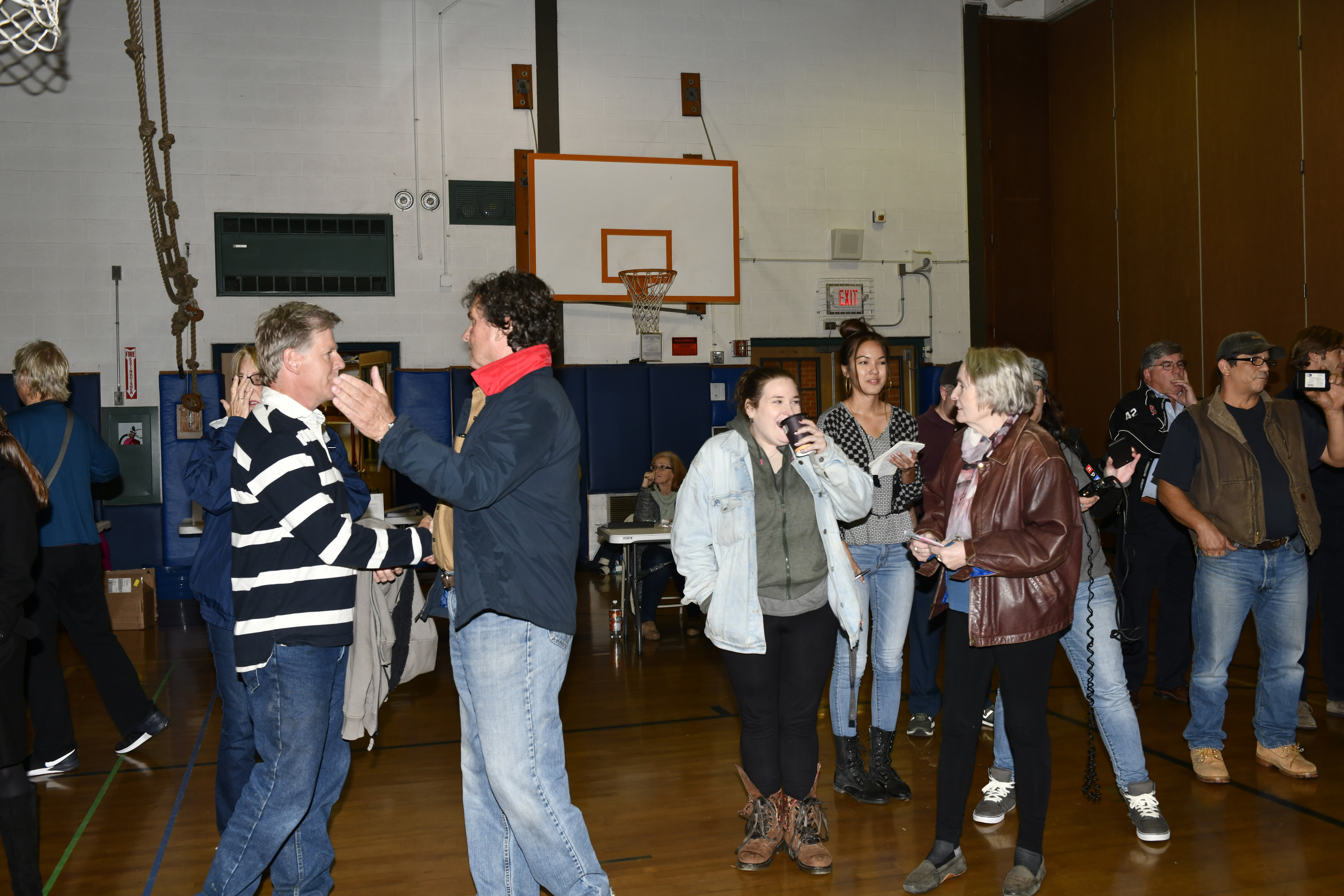 The crowd reacts to the vote at the East Quogue School on Thursday night.  DANA SHAW