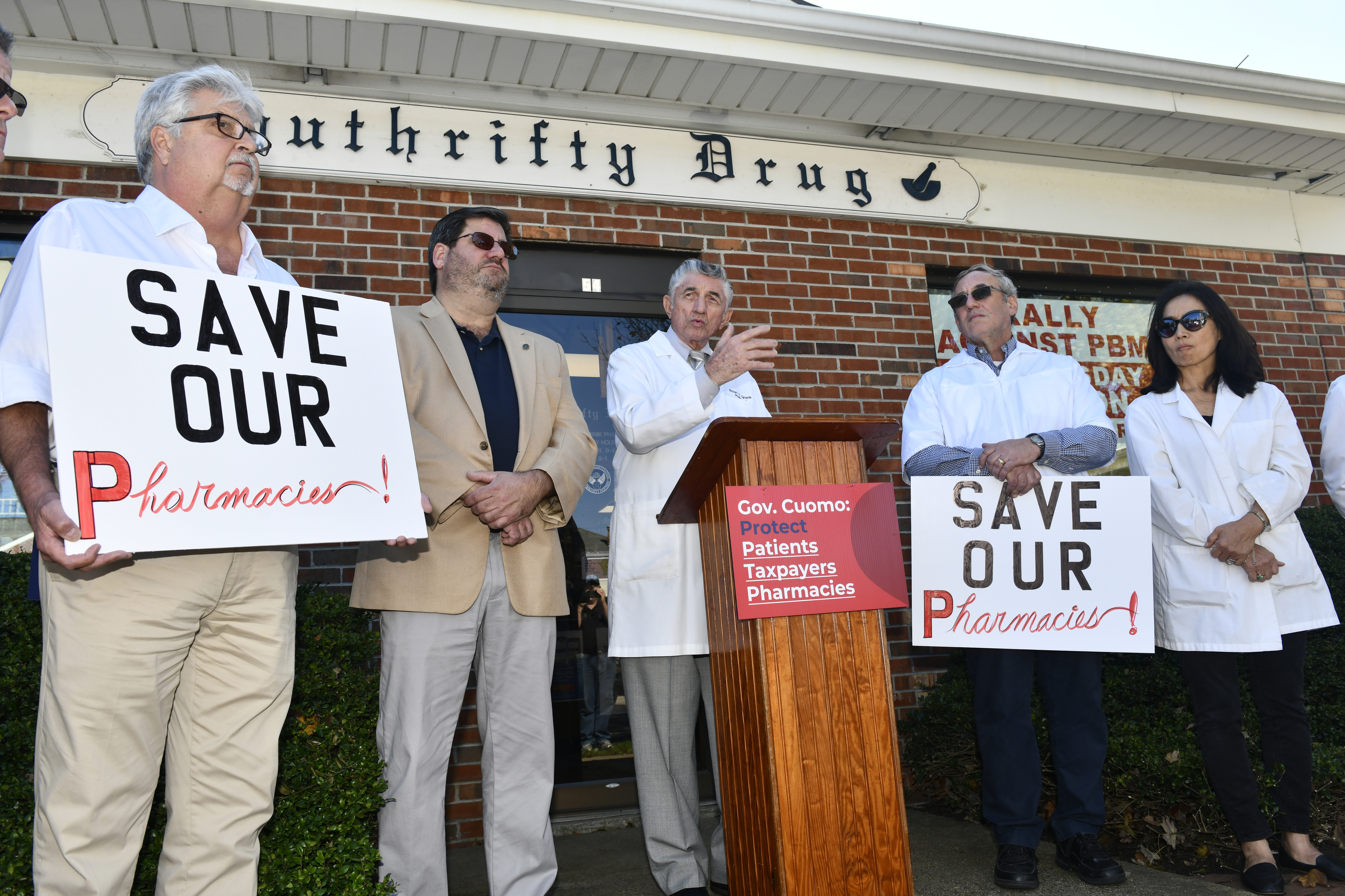 Pharmacist Robert Grisnik of Southrifty Drugs speaks out against PBMs in front of his store on Wednesday, October 23. DANA SHAW