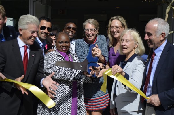 Officials involved with the development of the Sandy Hollow Cove Apartments in Tuckahoe cut the ribbon to celebrate its opening Monday morning. ANISAH ABDULLAH