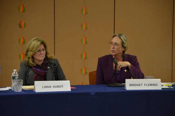 Linda Kabot and Bridget Fleming participated in a debate at the Hampton Bays Community Center Monday night. ANISAH ABDULLAH