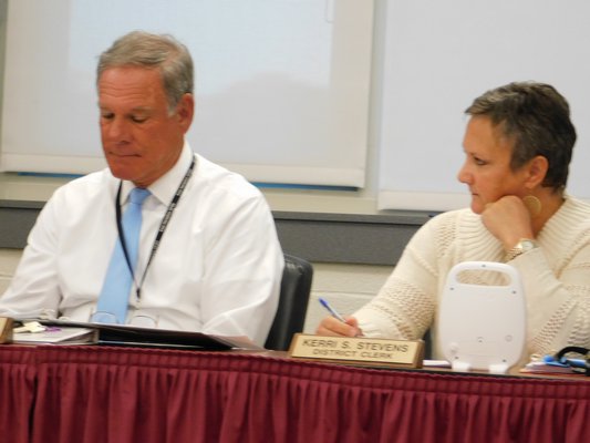 East Hampton School District Superintendent Richard Burns and District Clerk Kerri Stevens at the most recent school board meeting announcing the vaping forum.   ELIZABETH VESPE