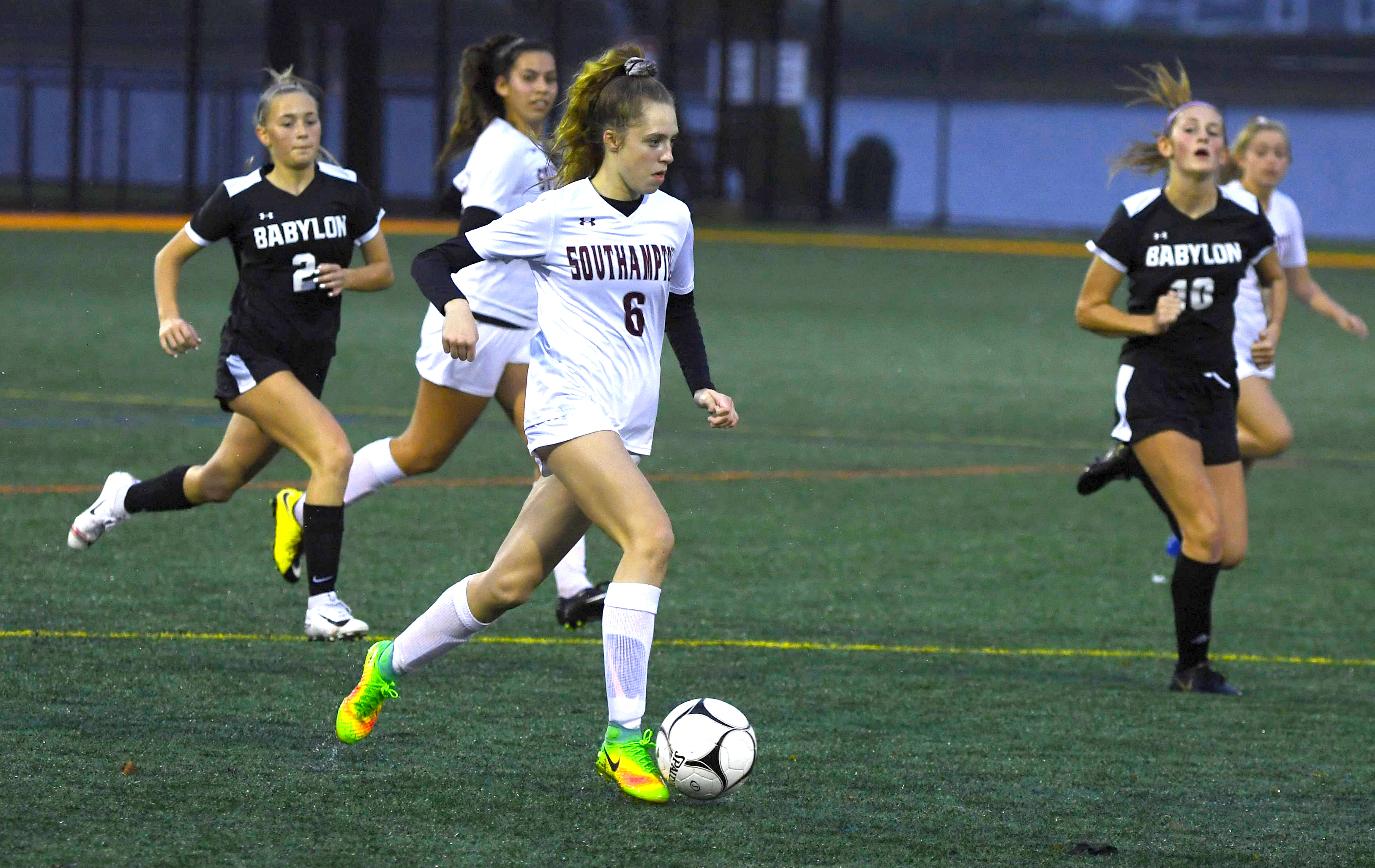 Sophomore forward Taylor Zukosky finds some breathing room in transition as Babylon's Kate Ficken (2) and Campbell Stein (10) give chase.