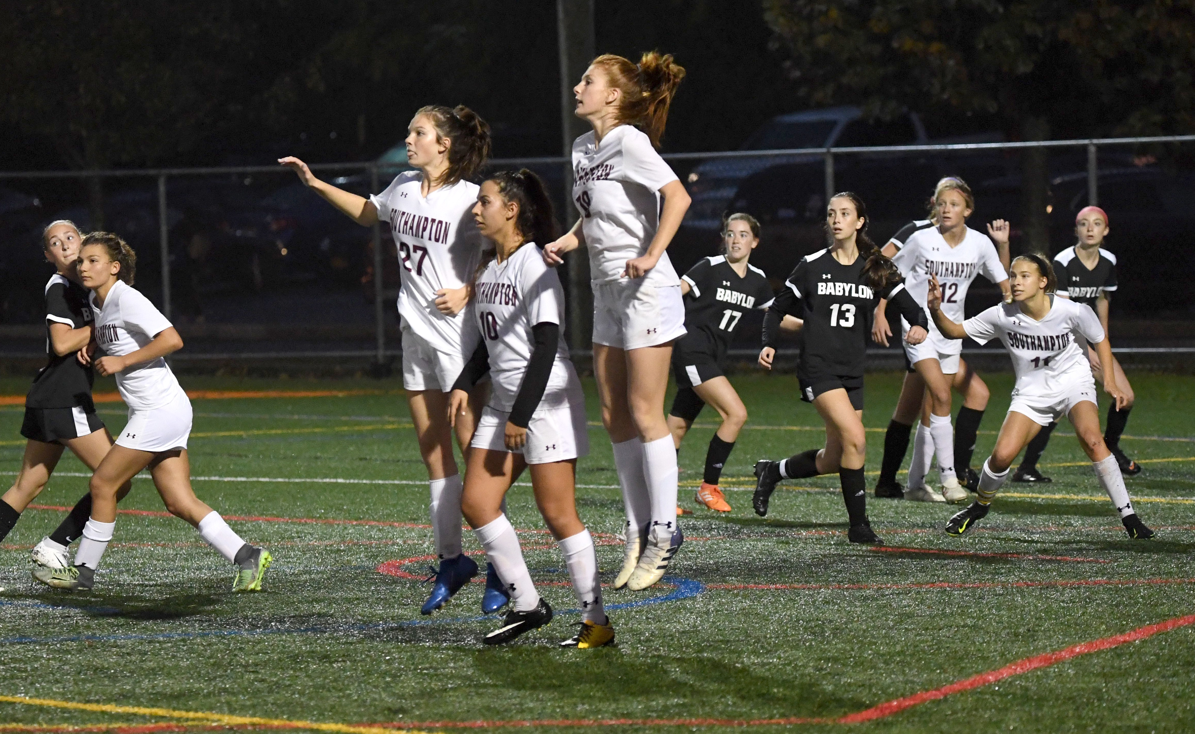 Hailey Cameron (27), Isabelle Palumbo (10) and Carli Cameron (18) form a wall as Babylon attempts a free kick in front of the Southampton box.
