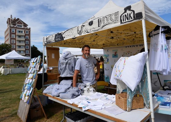 The Montauk Lions Club sponsored a Crafts Fair on the Montauk Green on Saturday and Sunday, drawing a variety of craftspeople and buyers. Peter Spacek at his Montauk-themed booth. KYRIL BROMLEY