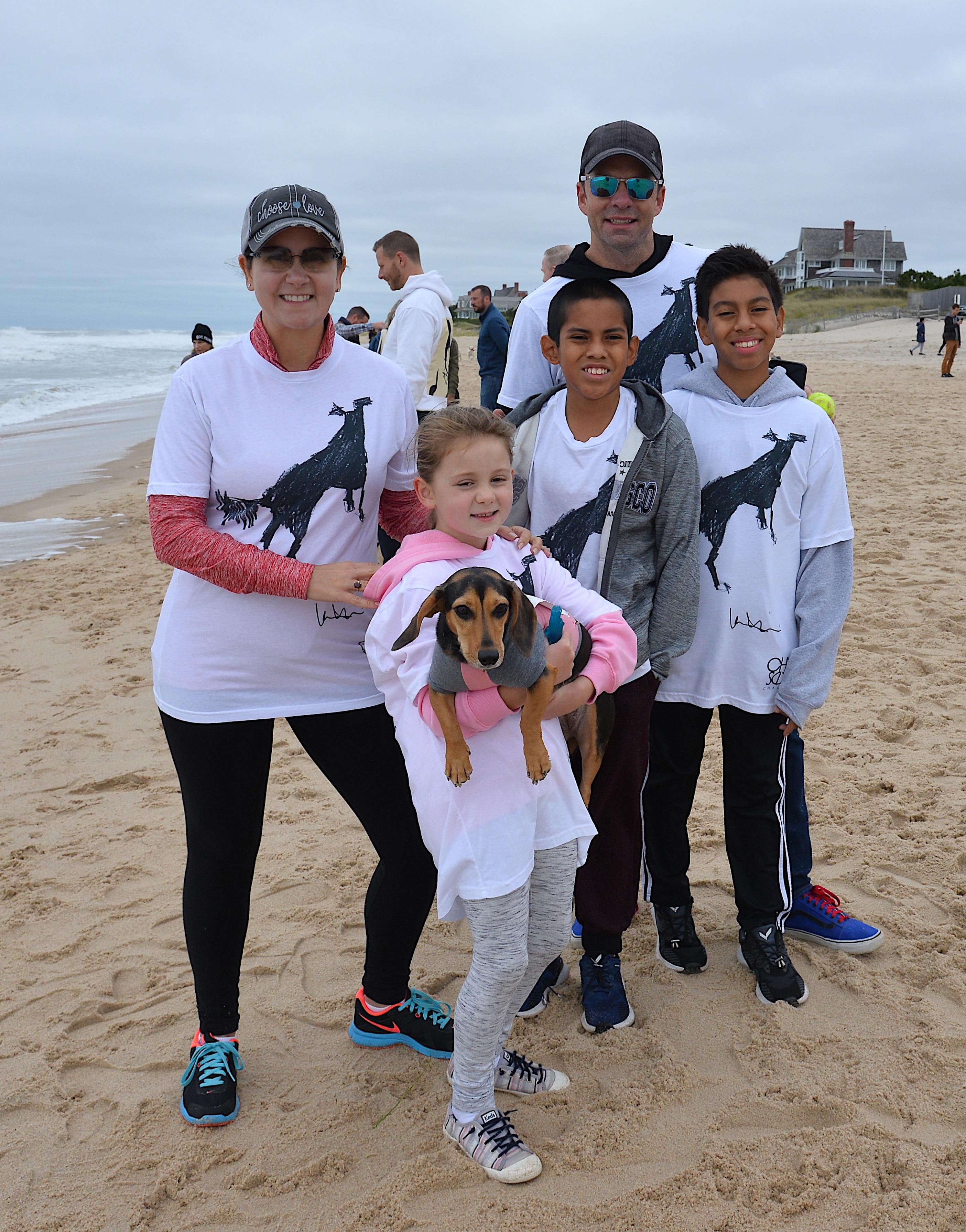 Dozens of supporters turned out for the annual Animal Rescue Fund of the Hamptons Stroll To The Sea on Saturday. The DeCarlo-Cooper family with brought Flo.  KYRIL BROMLEY