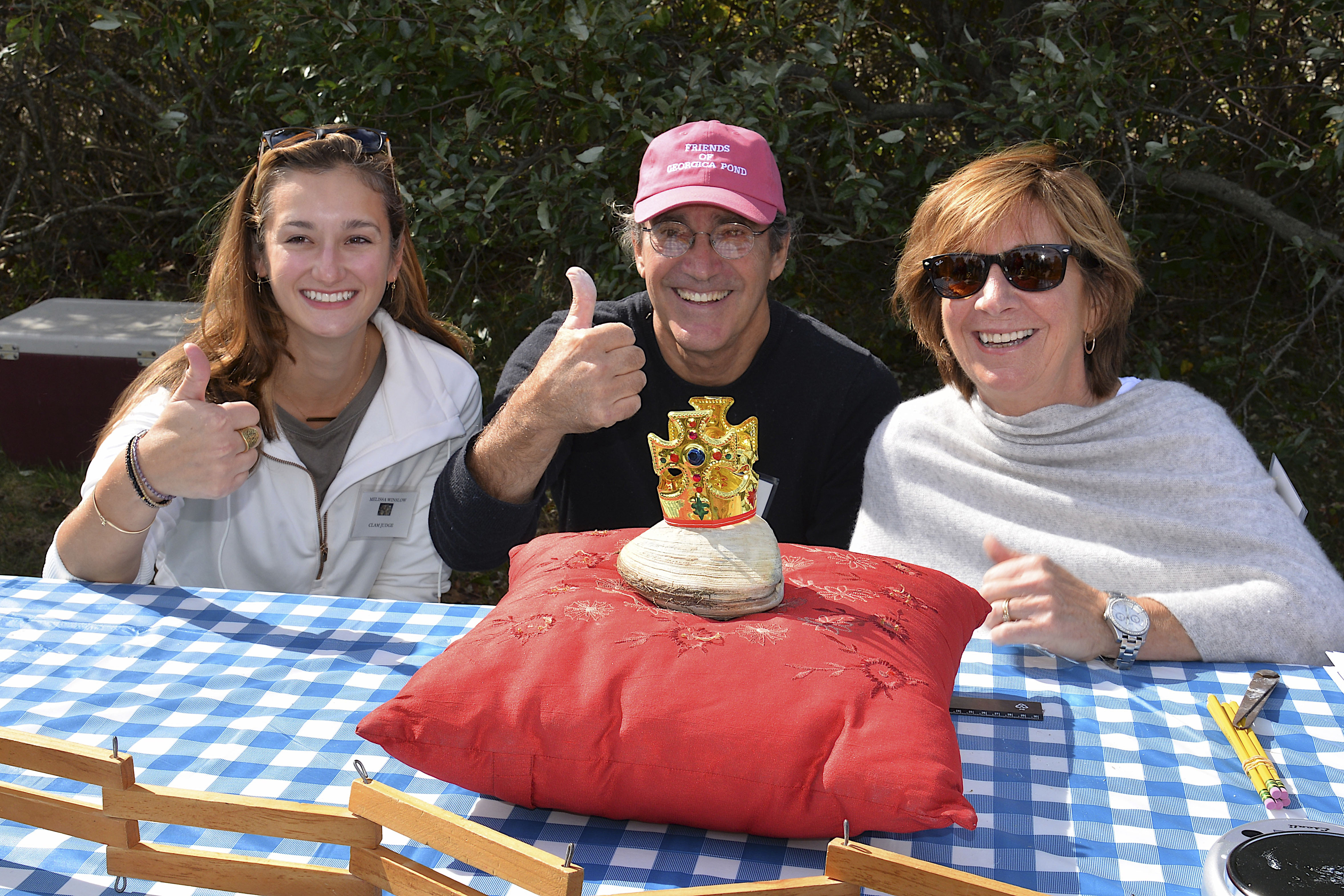 Melissa Winslow, John Aldred and Kim Shaw with the largest clam.