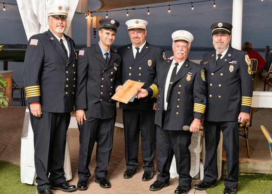 The Southampton Town Fire Chiefs Council honored East End firefighters and EMTs of the year at a dinner at Dockers restaurant in East Quogue on Saturday. The Westhampton Beach Firefighter of the Year was Paul Bugge. From left, Southampton Fire Department Ex-chief Buddy Wines, Firefighter Paul Bugge, Southampton Fire Department Ex-chief Mike Kampf, Westhampton Beach Fire Department Chief Halsey Stevens, and Quogue Fire Department Ex-chief Ed McGrath. Courtesy Westhampton Beach Fire Department