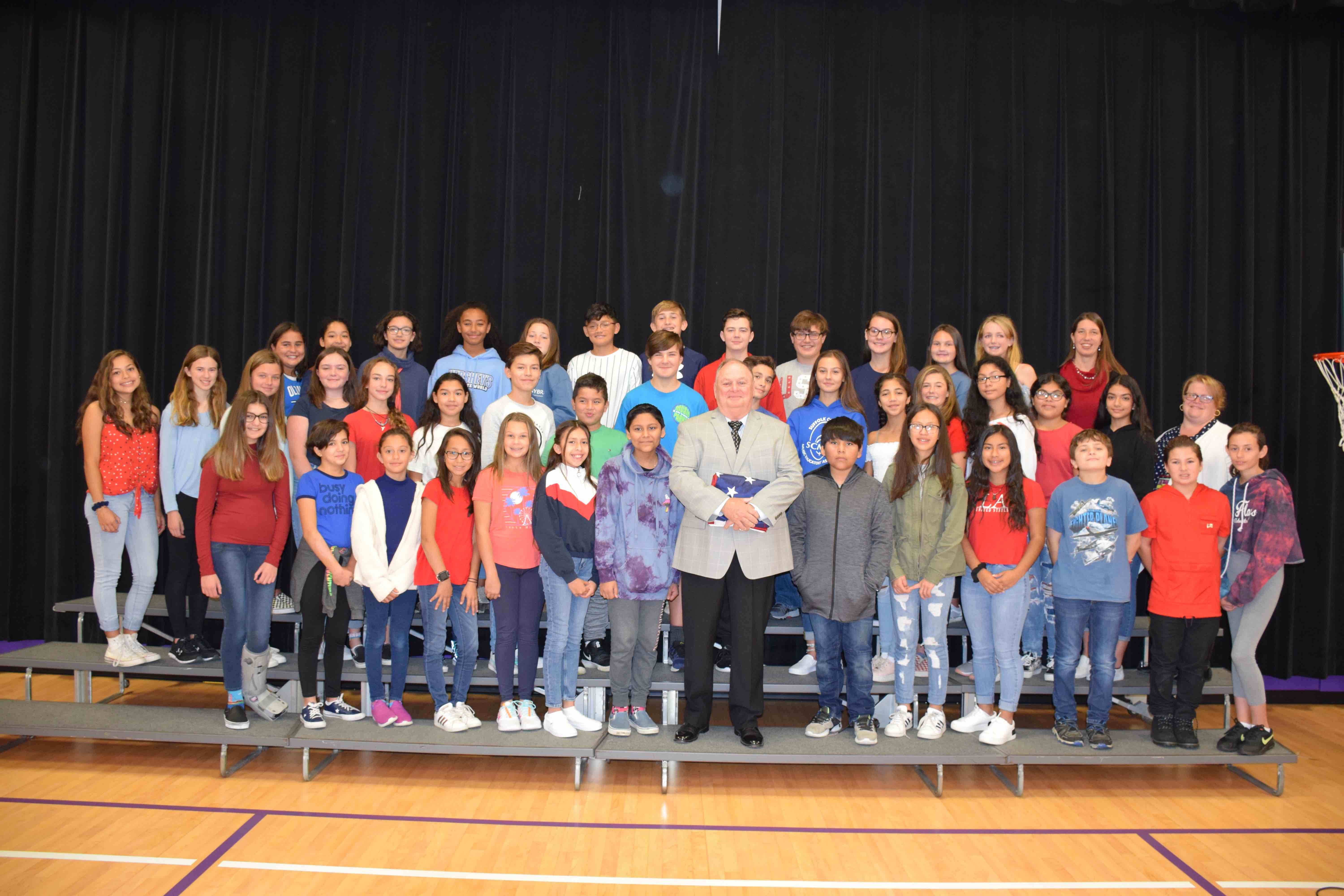 Hampton Bays Middle School students honored U.S. Navy veteran Timothy Fennelly during a flag ceremony on October 18.