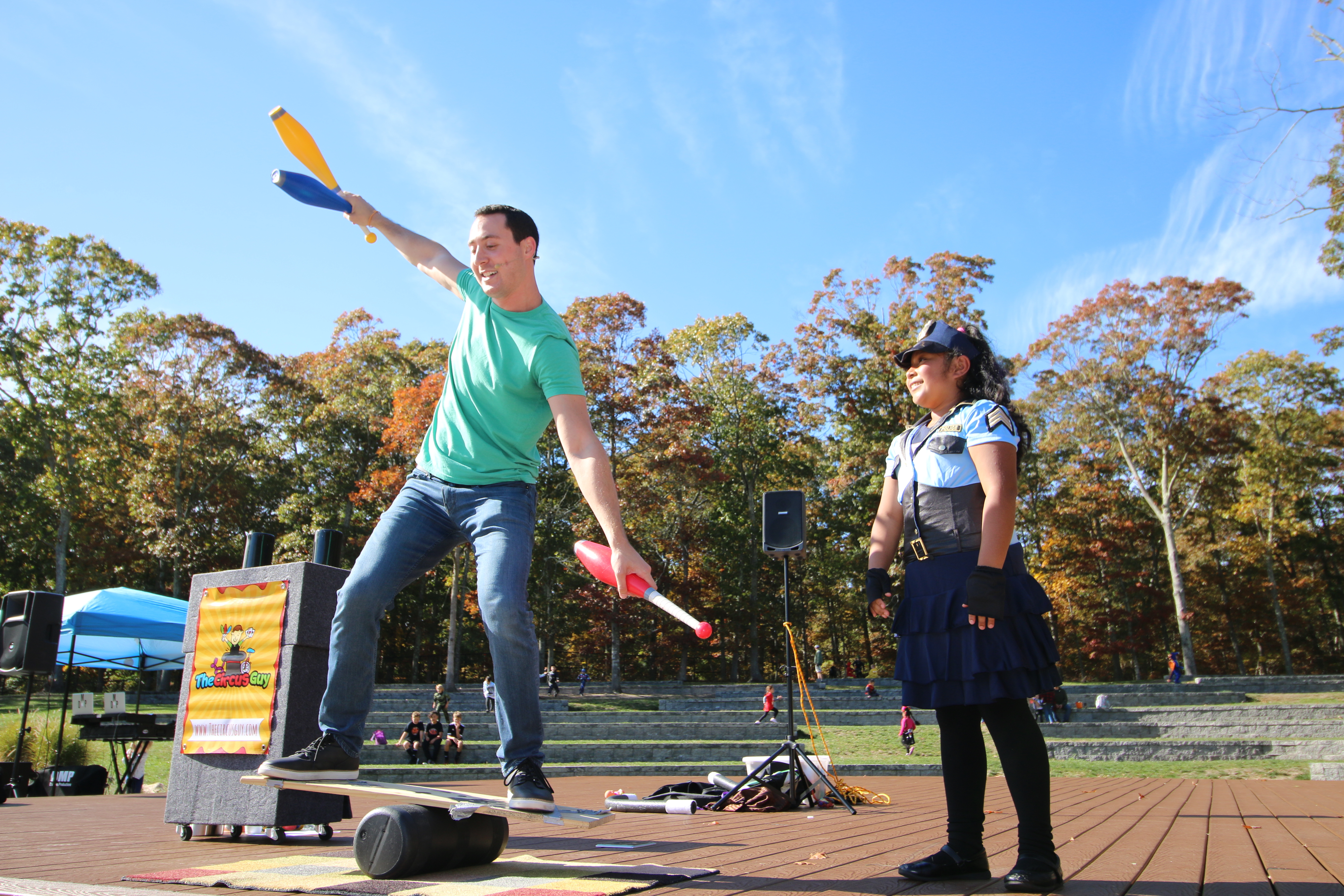 The Circus Guy and Kelsey Martinez perform at Good Ground Park on Saturday.