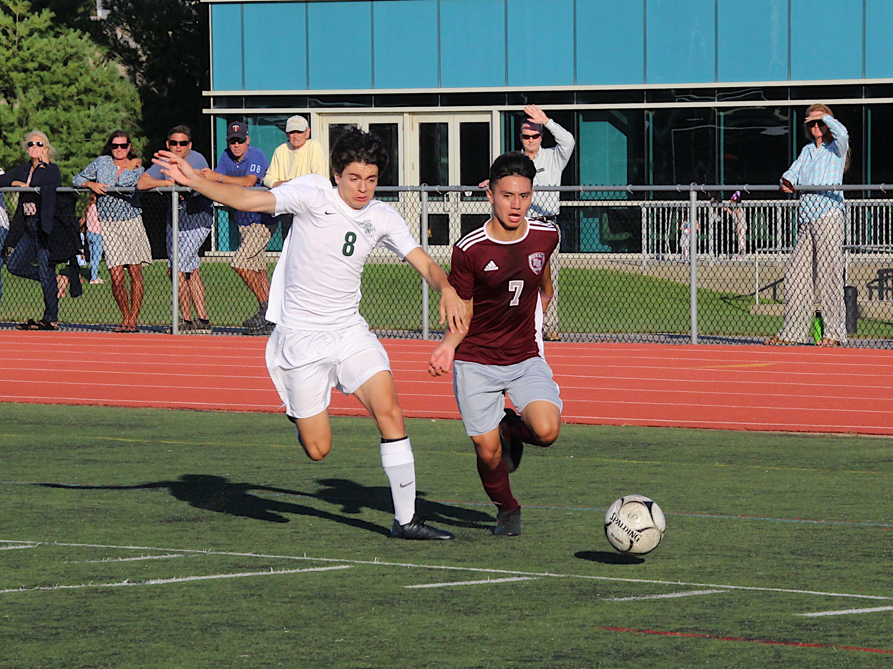 An East Hampton player plays the ball in the corner against Harborfields at home on September 24.