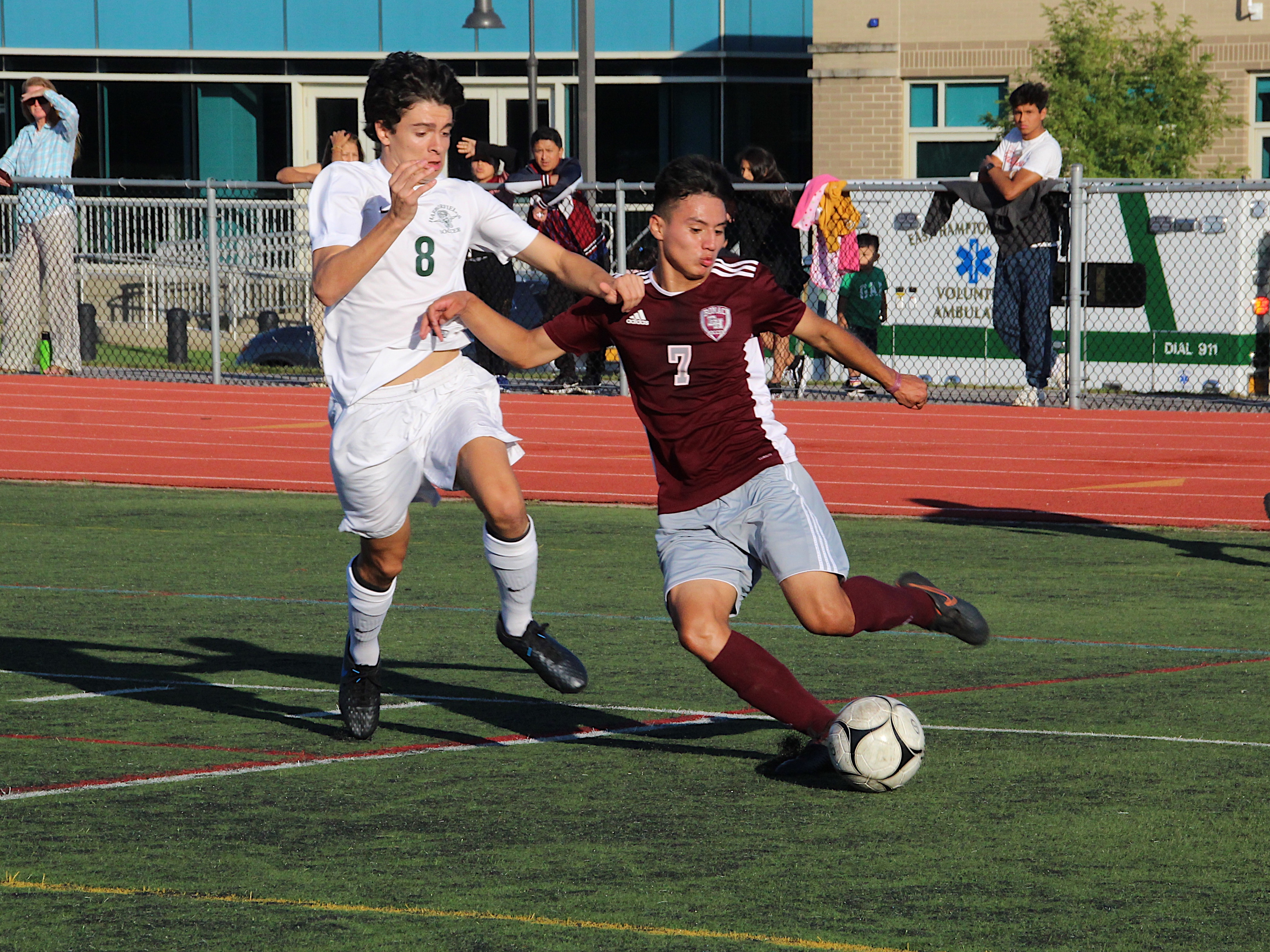 East Hampton junior Christopher Pintado plays the ball in the corner against Harborfields at home on September 24.