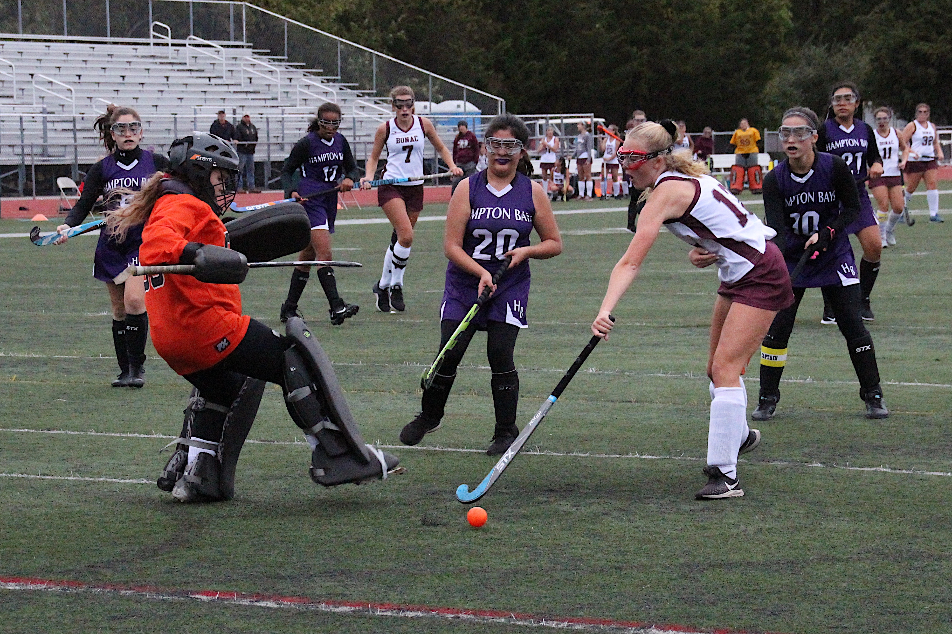 Hampton Bays goalie Abby Hoffman and defender Maria Reina comes out to stop East Hampton's Hanna Medler.