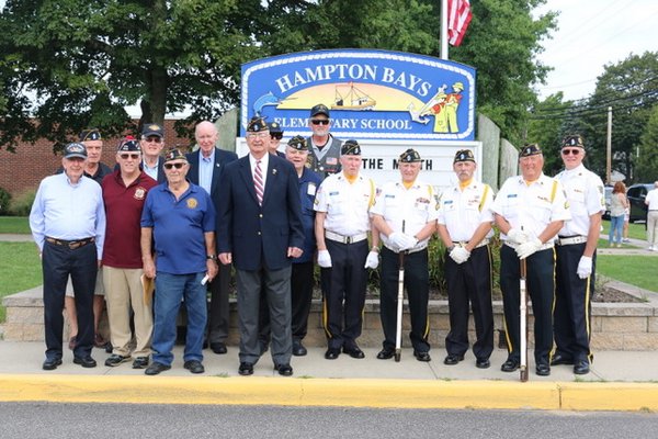 Hampton Bays School District flew the American flag in September in honor of local veteran Richard Mongiello Sr.