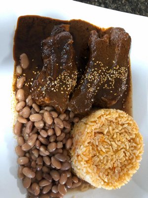 Mole Poblano with rice and beans.