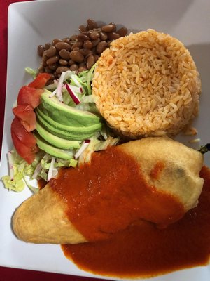 Chile Relleno with rice, beans, and avocado.