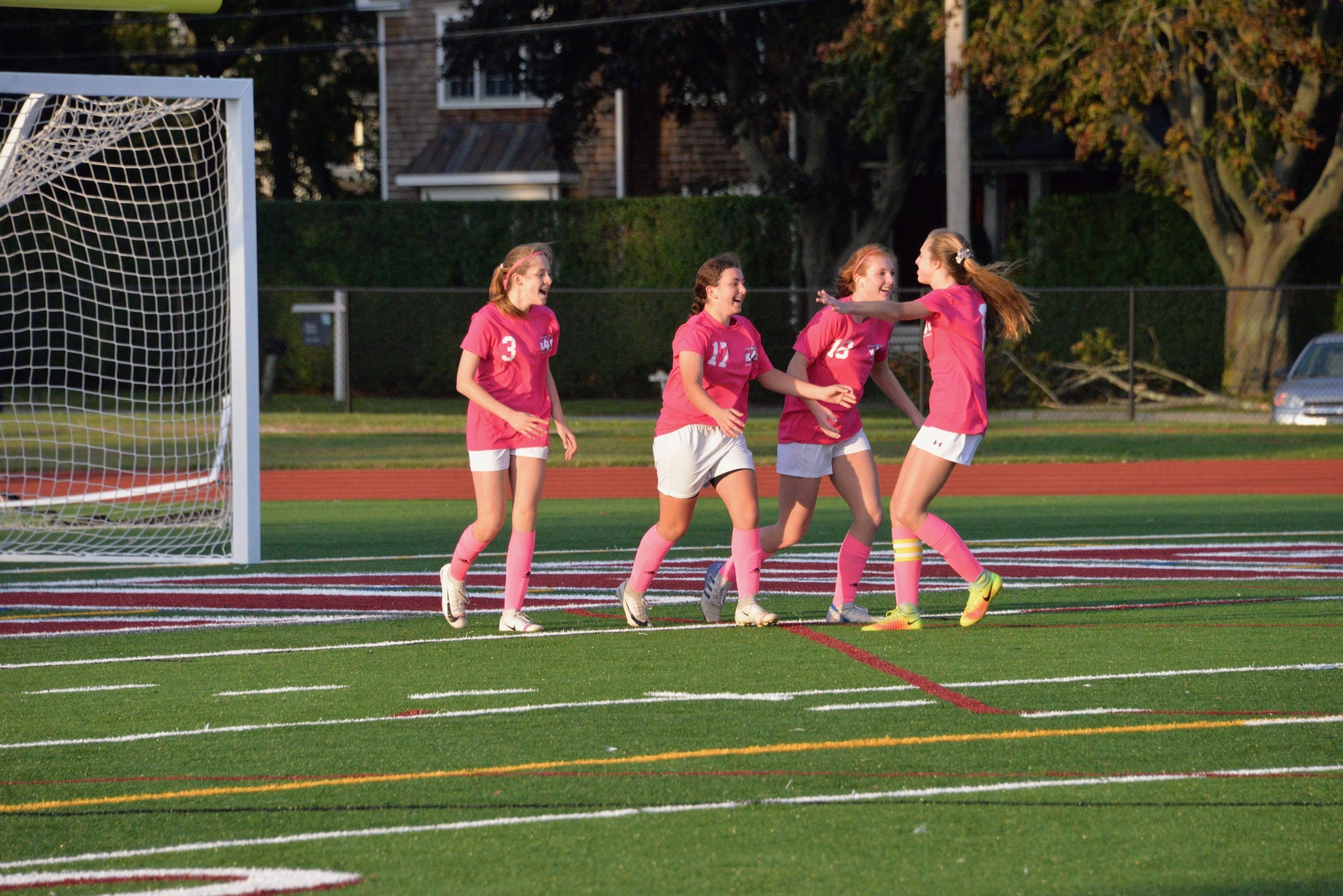 The Lady Mariners celebrate one of their three goals against Port Jeff last week.