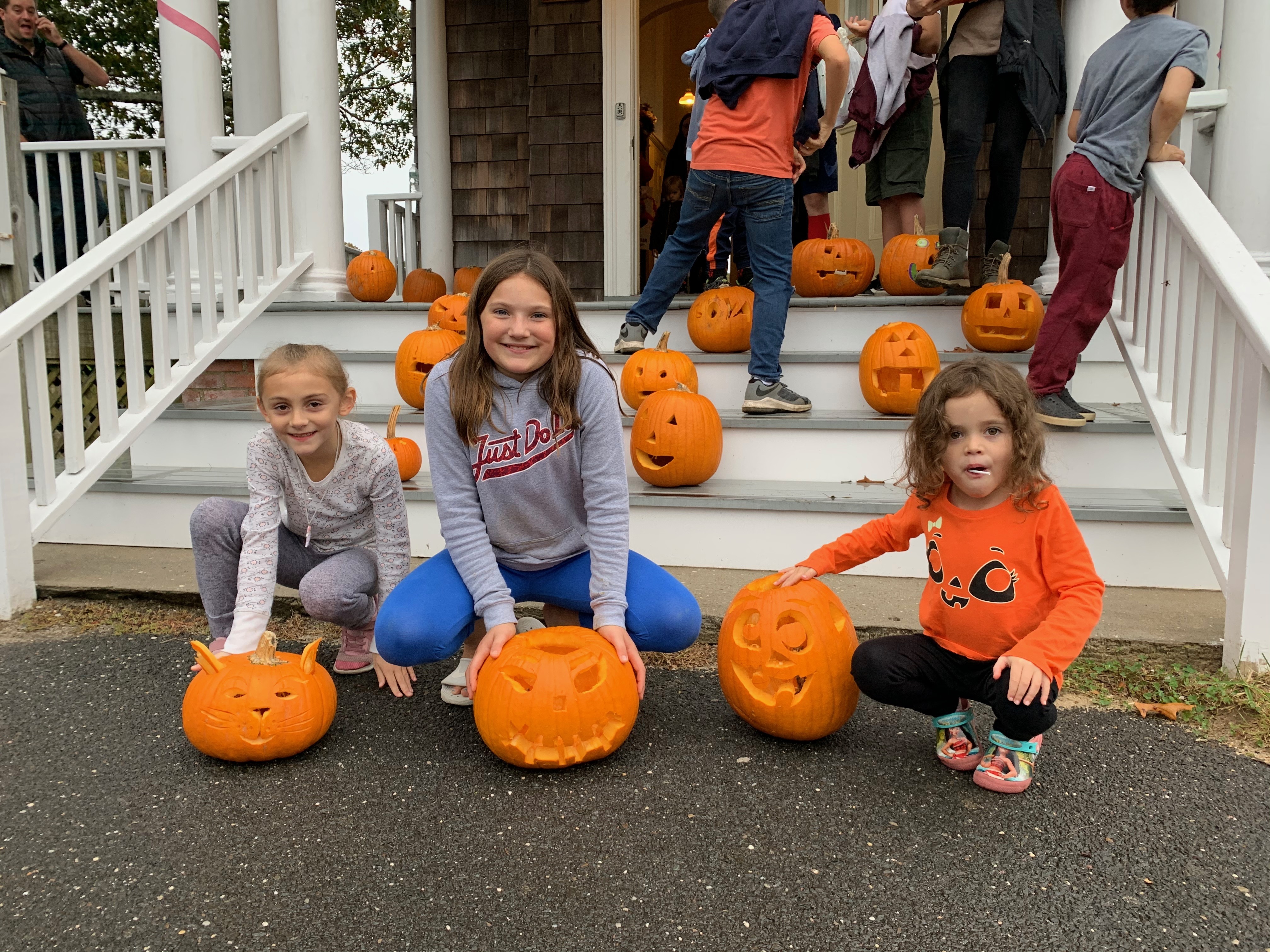 North Sea Community families gathered for its fourth annual pumpkin-carving party. Three from among the many terrific entries were chosen as prize-winners. From left, Francesca Dunkirk, Maggie Glanz and Olivia Milani each earned a $25 gift card donated by Southampton Town Kiwanis.