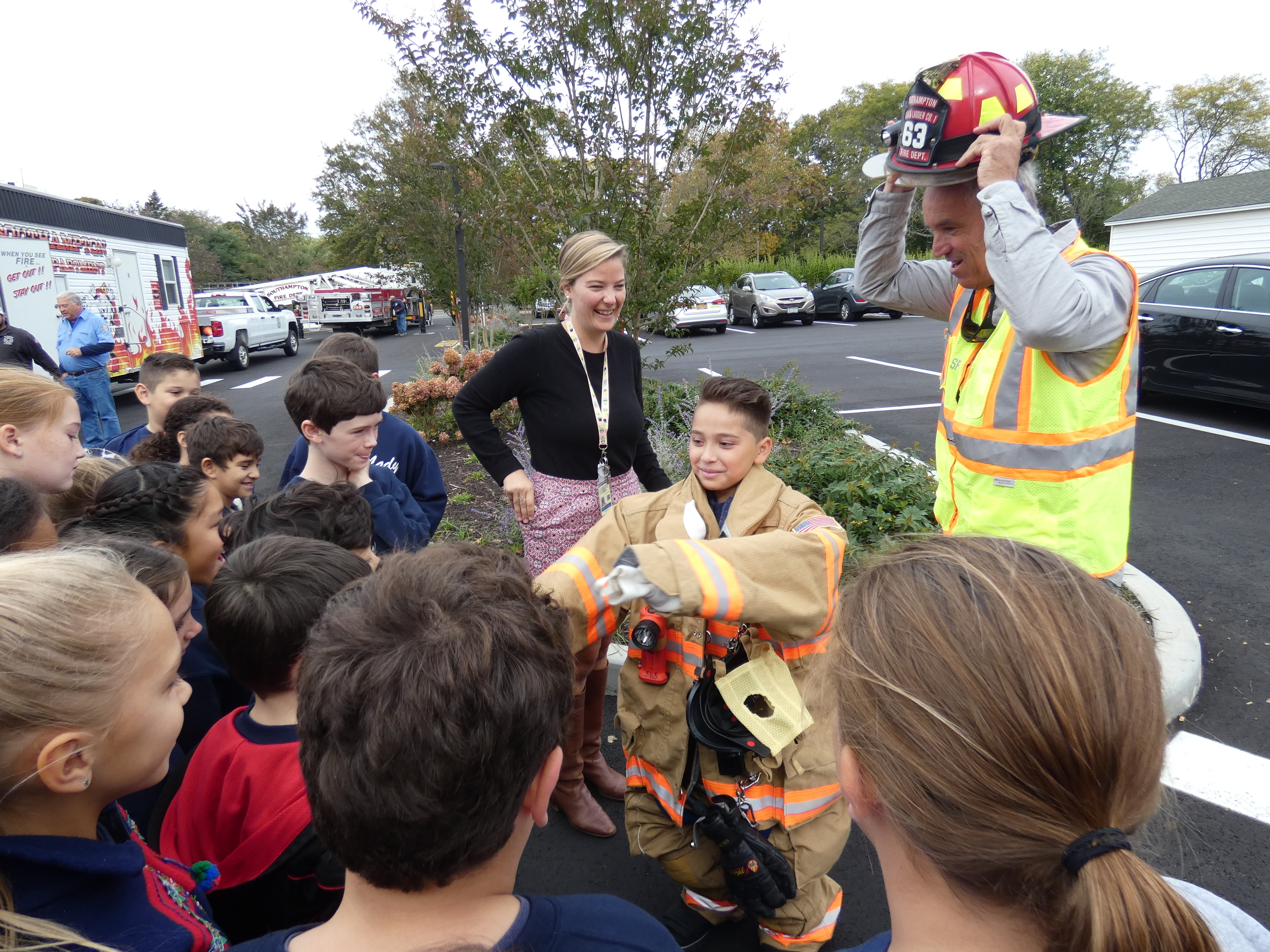 Our Lady of the Hamptons fourth-grader Jeremy Trellis gets suited up at the school's annual fire prevention day presented by Southampton Fire Department volunteers.