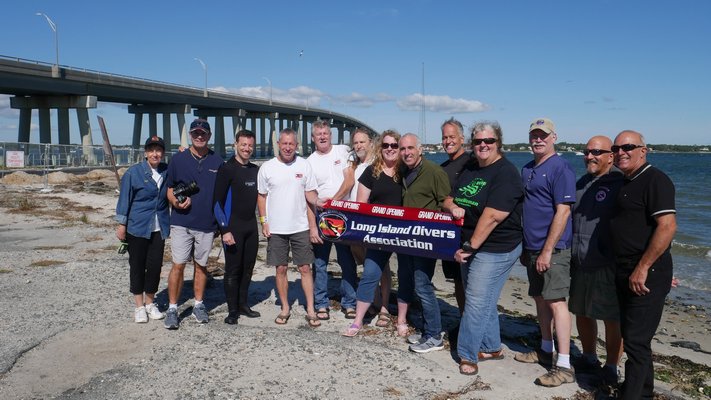 Southampton Town and the Long Island Divers Association held an underwater ribbon cutting at  Ponquogue Piers in Hampton Bays on Sunday, September 29.  According to the Long Island Divers Association, which did some research, this was the first underwater ribbon cutting on Long Island. Renovation of the Ponquogue Piers, the old Ponquogue Bridge, was recently completed. It was badly damaged during Super Storm Sandy in 2012. An above water ribbon cutting will be held at the South Pier on Friday, October 11th.