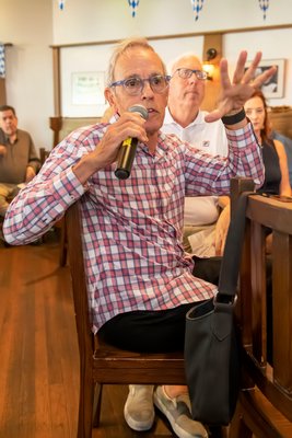 An attendee asks a question during the Press Sessions: Wind Farm forum at Rowdy Hall in East Hampton.    MICHAEL HELLER