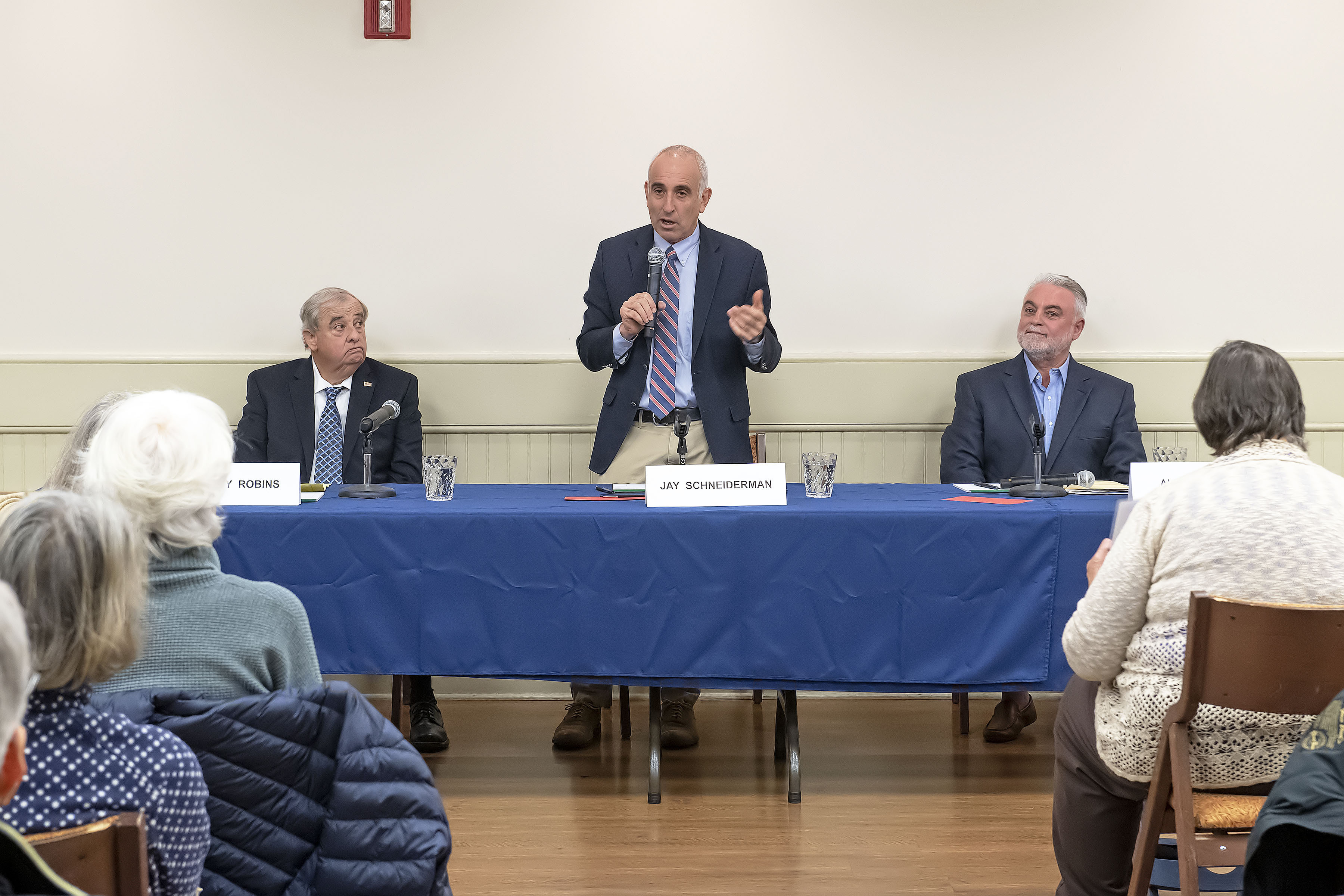 Southampton Town Supervisor Incumbent Candidate Jay Schneiderman speaks as candidates Gregory Robins and Alex Gregor look on during a Meet the Candidates Night sponsored by the League of Women Voters at the Rogers Memorial Library in Southampton on Thursday, October 17.     MICHAEL HELLER