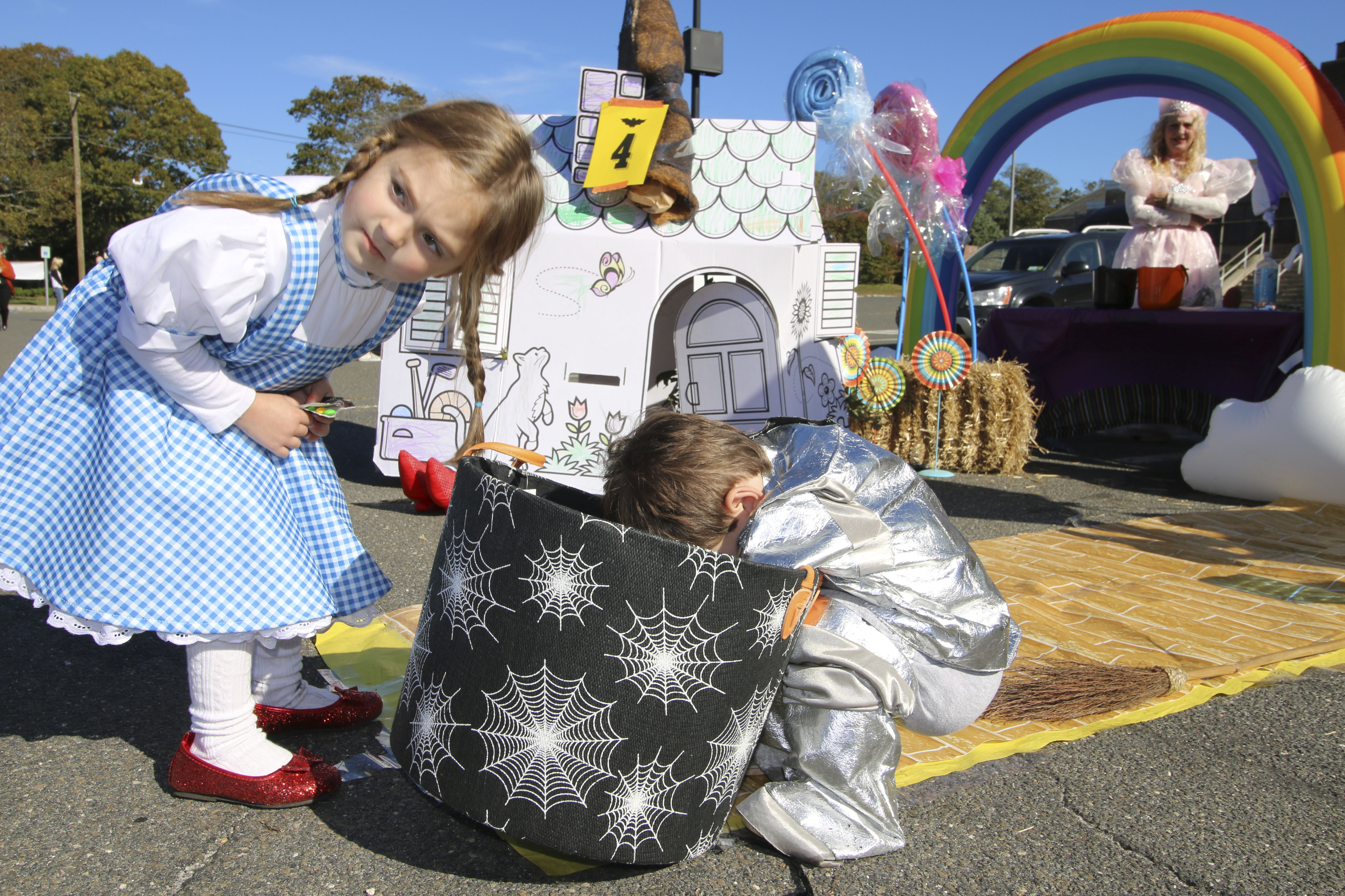 Rebecca and Will Chambers dig for candy at the Westhampton Free Library's Trunk or Treat at the Westhampton Beach Elementary School on Saturday.  SONDRA ROSANTE