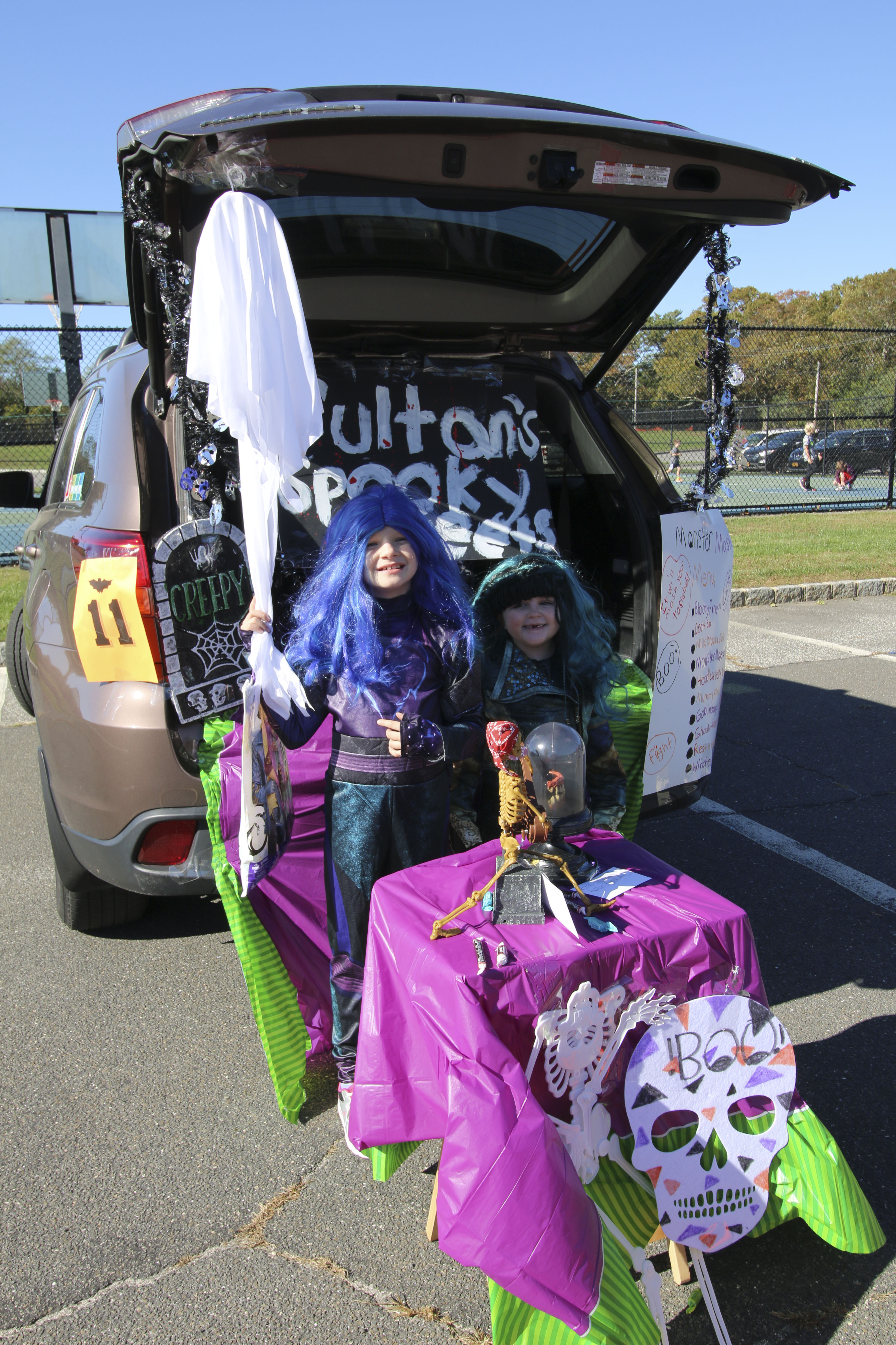 Ciara and Samantha McKee at the Westhampton Free Library's Trunk or Treat at the Westhampton Beach Elementary School on Saturday. SONDRA ROSANTE