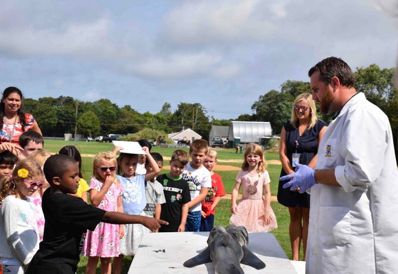 Westhampton Beach Elementary School students were amazed at the sight of a great white shark as they learned about it from high school science teacher Matthew Berkhout.