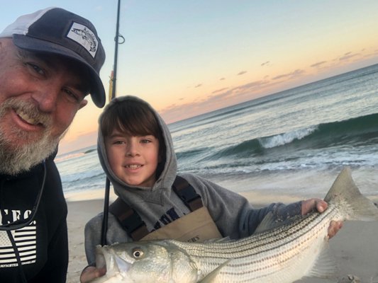 Michael and Mikey Dean picked a few keeper-sized striped bass out of the surf in Quogue this weekend.