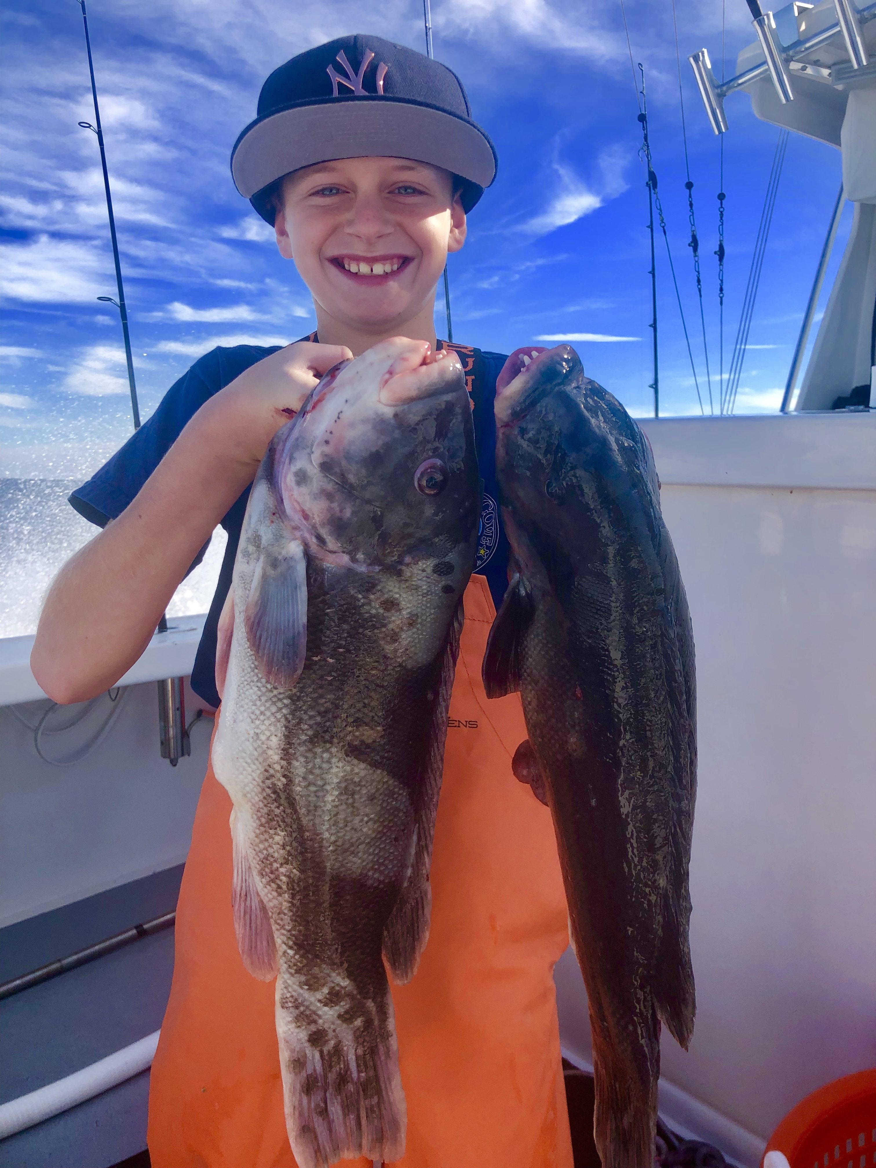 Brayden Fromm with a pair of big blackfish caught aboard his dad's boat, the Flying Dutchman, off Montauk last weekend.