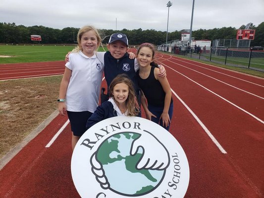 Raynor Country Day School fourth-grader Rebecca Bartha, Finnley Coonan and Isabelle Grucci-Petersen, and third-grader Luna Pulver were among those participating in the Laps-for-Life event hosted by the local Knights of Columbus on October 6 at Center Moriches High School. The event was a fundraiser for Peconic Bay Medical Center Northwell Health's women's programs.