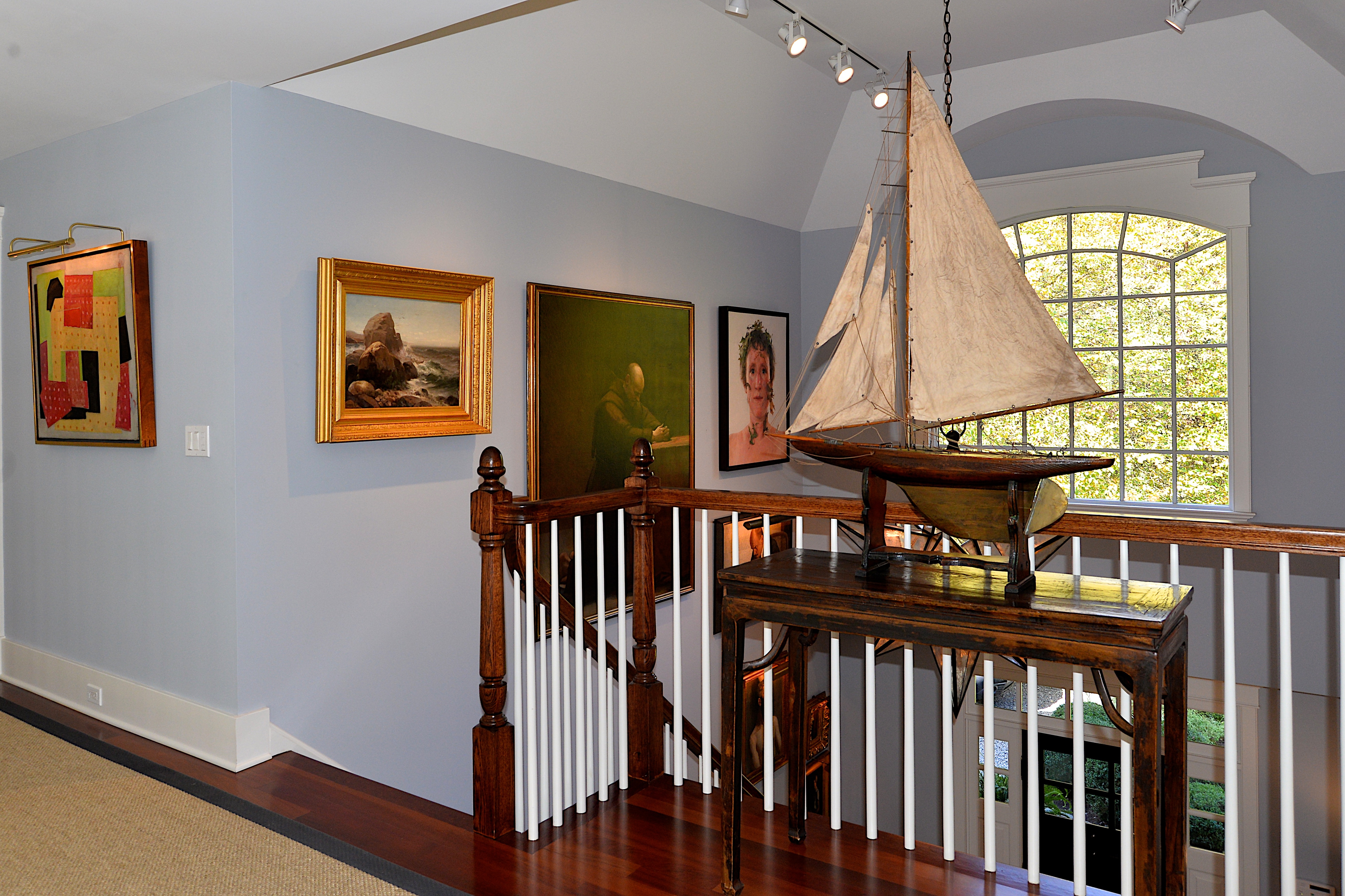 A model ship is among the antiques that adorn the home.