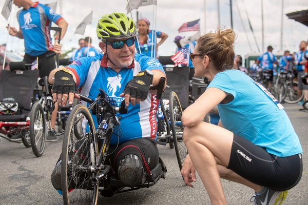 British Military soldier Clive Smith chats with a Soldier Ride participant in Sag Harbor during the 2018 Solider Ride benefitting Wounded Warrior.