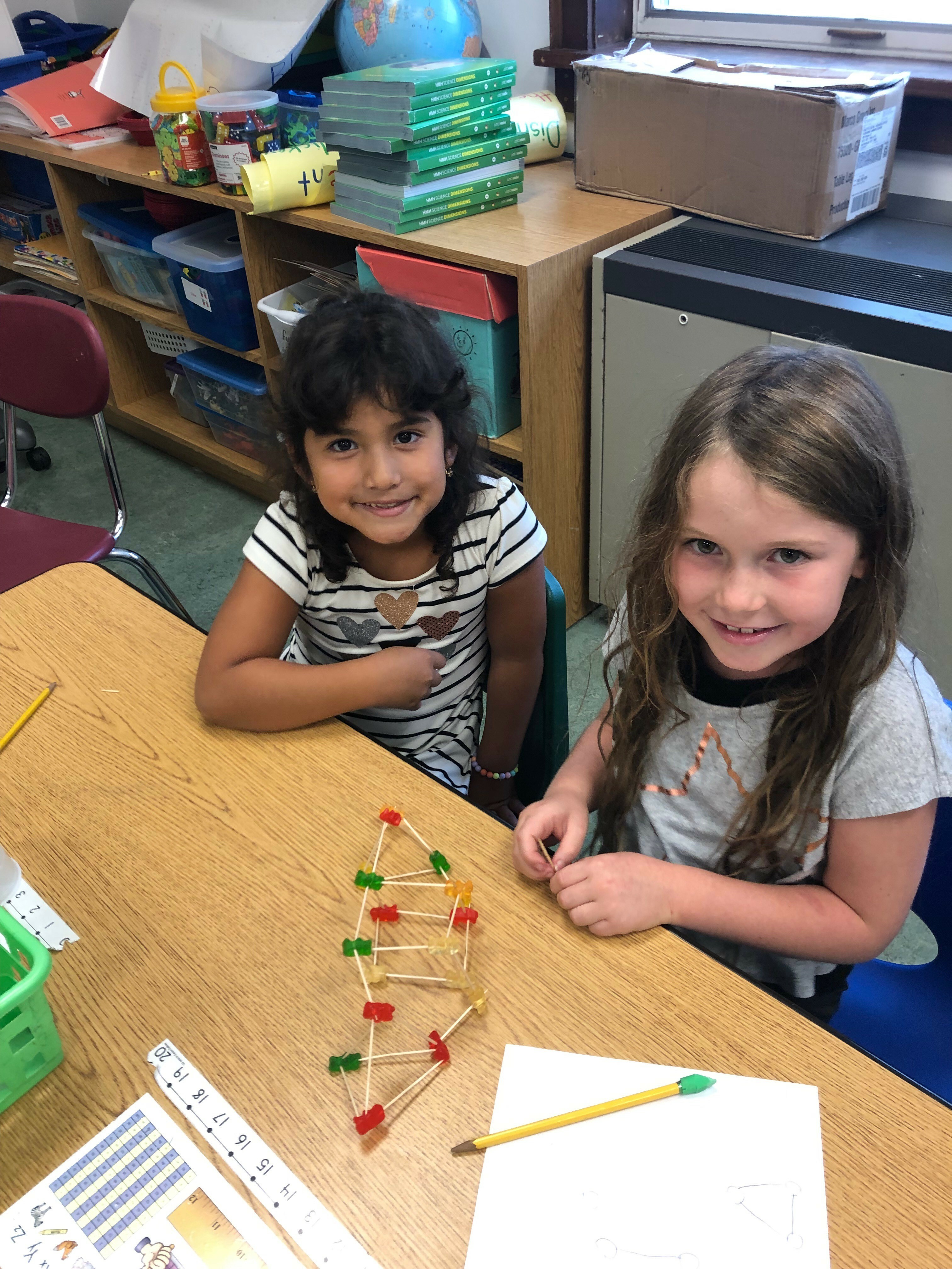 Tuckahoe School first-gradersare learning about engineering. They were given a problem, developed a plan, built a structure to solve the problem, then tested their ideas and made changes. They were given only toothpicks and gummy bears to build a small structure strong enough to support a textbook.