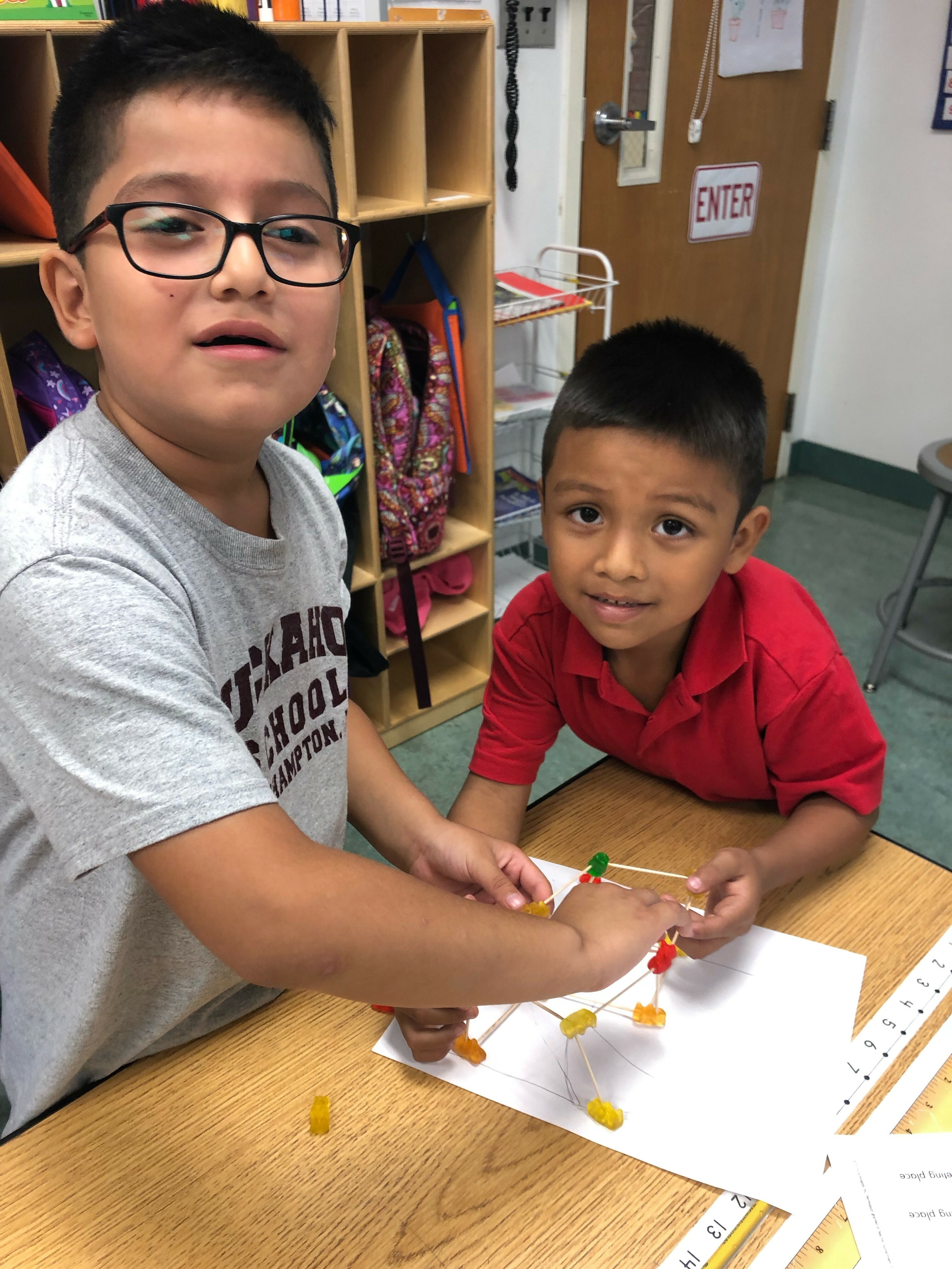Tuckahoe School first-gradersare learning about engineering. They were given a problem, developed a plan, built a structure to solve the problem, then tested their ideas and made changes. They were given only toothpicks and gummy bears to build a small structure strong enough to support a textbook. Oscar Ochoa and Angel Martinez Sosa with their project.
