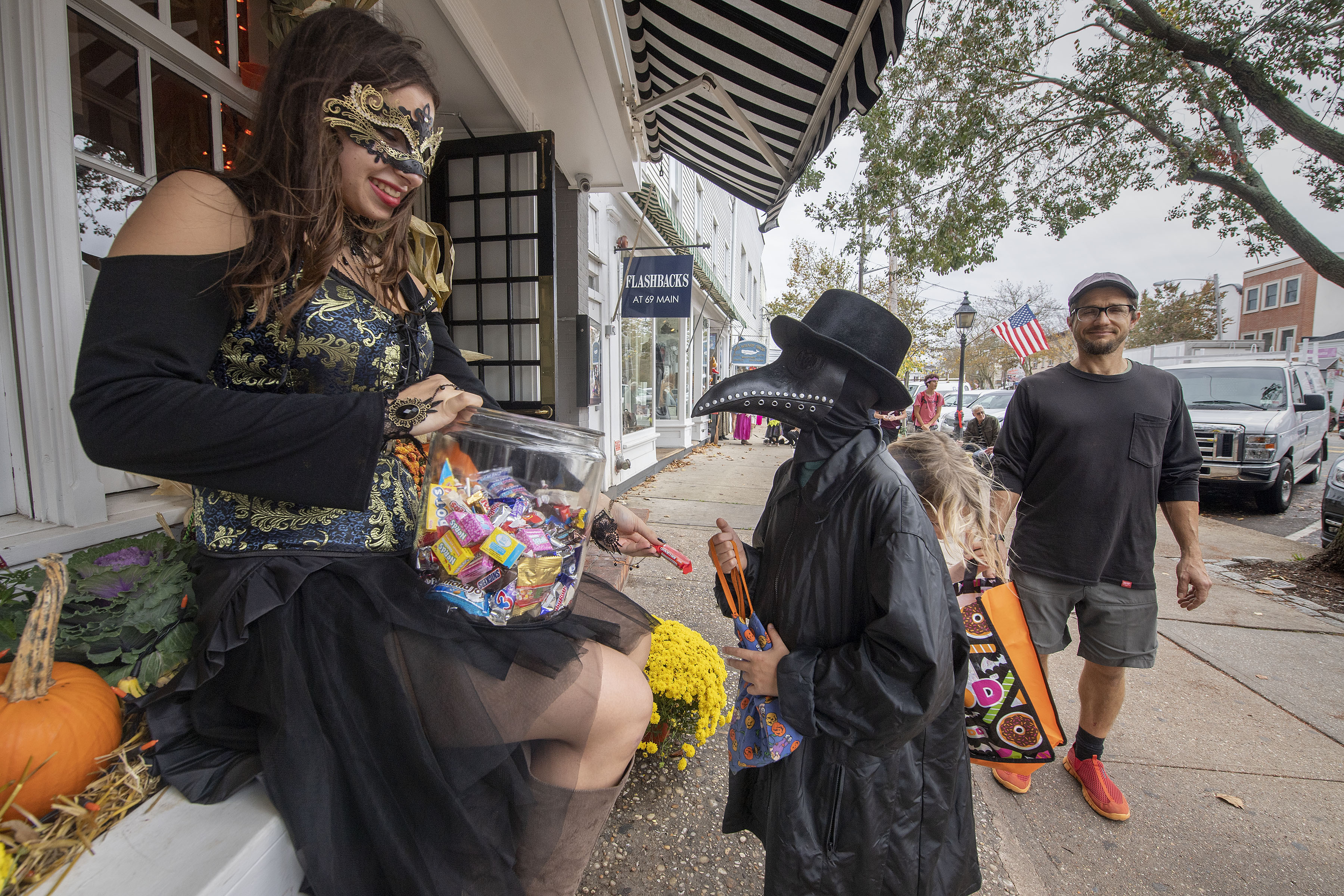 Kids get candy at Page Restaurant during the 2019 Pumpkin Trail on Main Street in Sag Harbor on Thursday, October 31.  MICHAEL HELLER