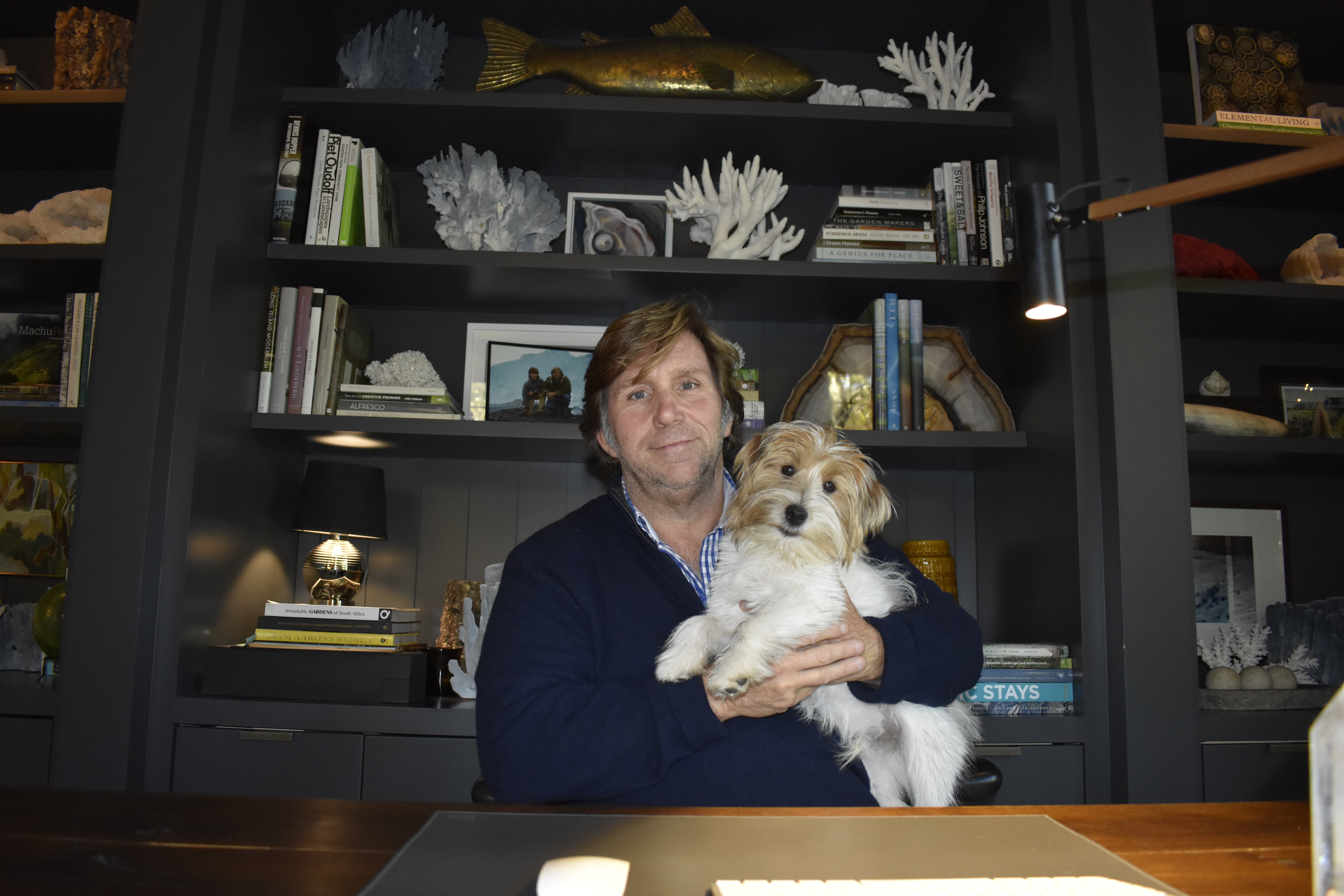 Michael Derrig and his wire-haired Jack Russell terrier Carlos in his office. BRENDAN J. O'REILLY