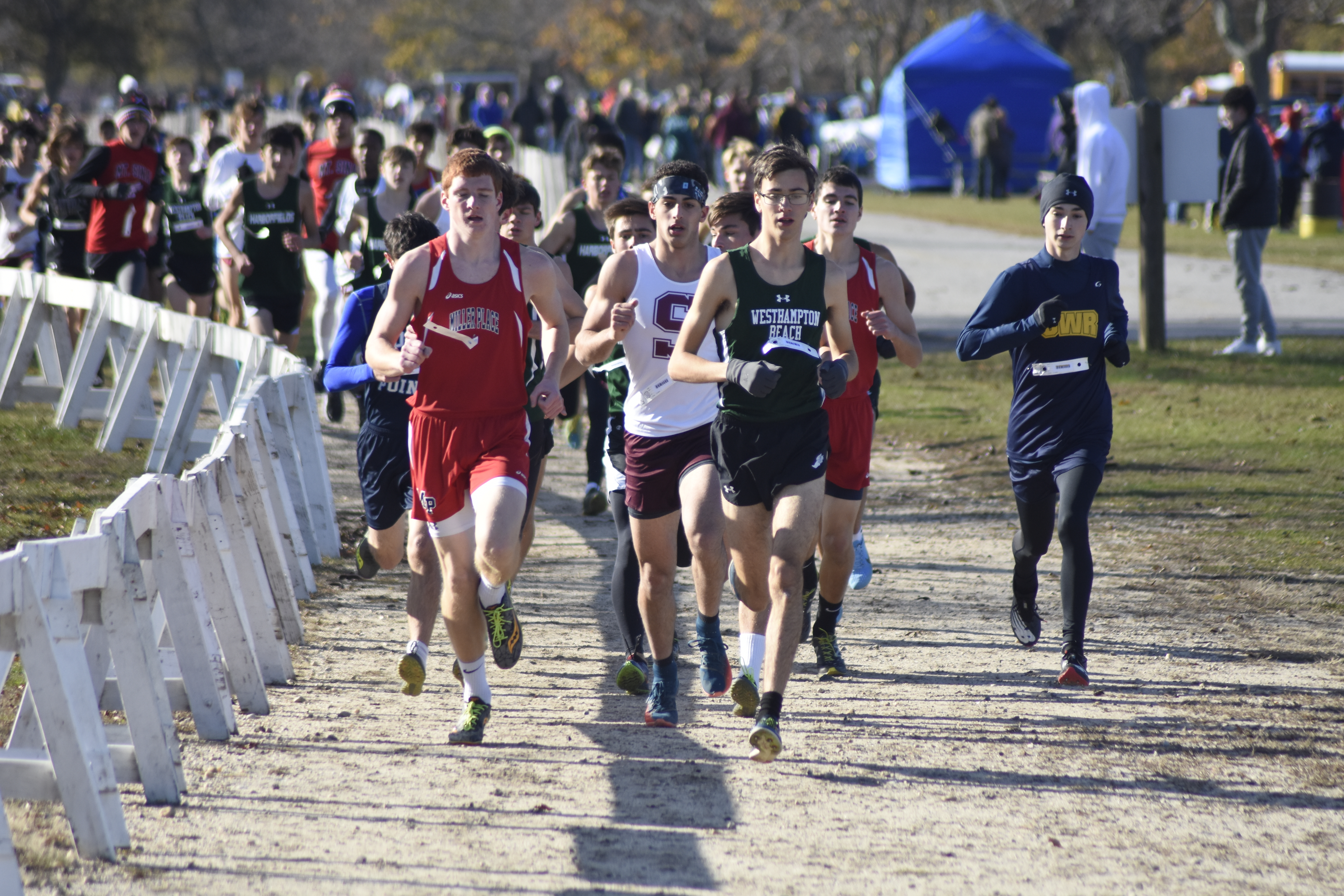 Gavin Ehlers of Westhampton Beach brings out the pack of runners quickly to start the race.