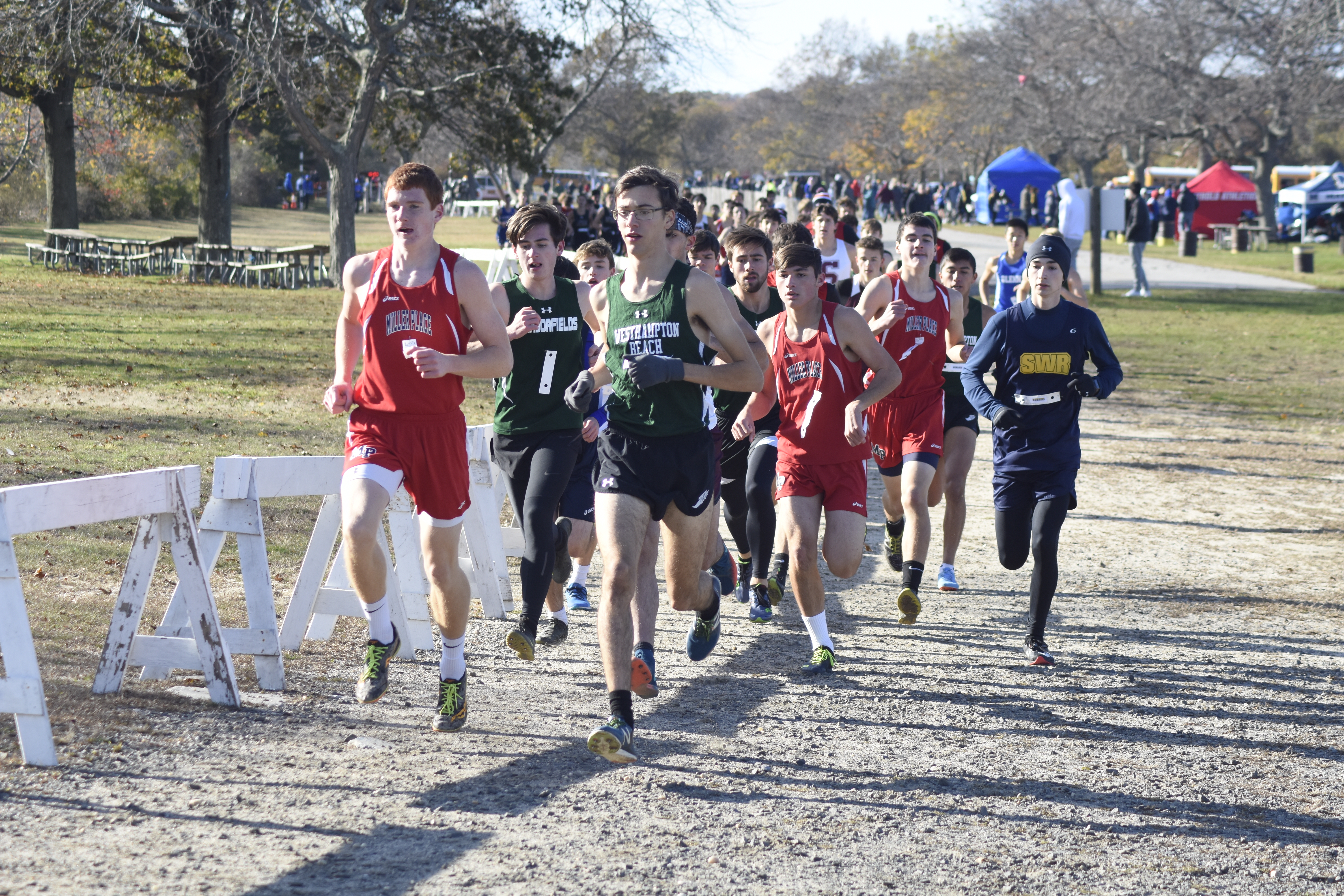 Gavin Ehlers of Westhampton Beach brings out the pack of runners quickly to start the race.